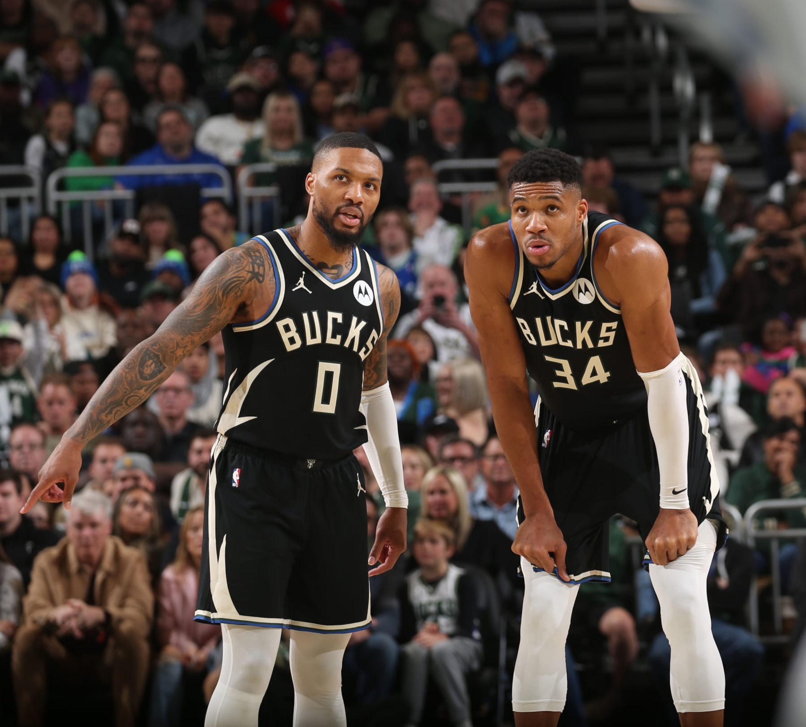 MILWAUKEE, WI - NOVEMBER 18: Damian Lillard #0 and Giannis Antetokounmpo #34 of the Milwaukee Bucks talk during the game against the Dallas Mavericks on November 18, 2023 at the Fiserv Forum Center in Milwaukee, Wisconsin. NOTE TO USER: User expressly acknowledges and agrees that, by downloading and or using this Photograph, user is consenting to the terms and conditions of the Getty Images License Agreement. Mandatory Copyright Notice: Copyright 2023 NBAE (Photo by Gary Dineen/NBAE via Getty Images).