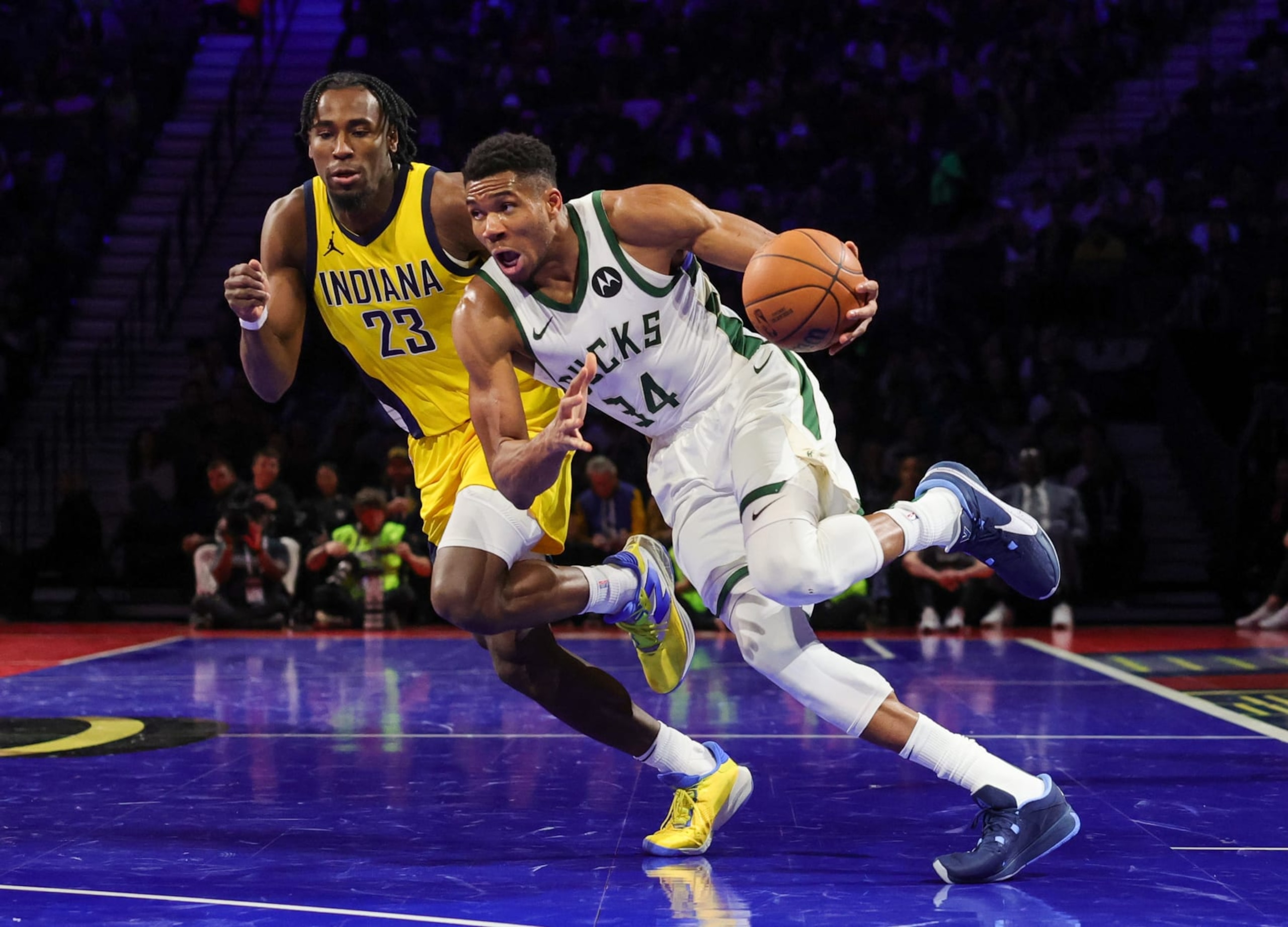 LAS VEGAS, NEVADA - DECEMBER 07: Giannis Antetokounmpo #34 of the Milwaukee Bucks drives against Aaron Nesmith #23 of the Indiana Pacers in the second half of the East semifinal game of the inaugural NBA In-Season Tournament at T-Mobile Arena on December 07, 2023 in Las Vegas, Nevada. The Pacers defeated the Bucks 128-119. NOTE TO USER: User expressly acknowledges and agrees that, by downloading and or using this photograph, User is consenting to the terms and conditions of the Getty Images License Agreement. (Photo by Ethan Miller/Getty Images)