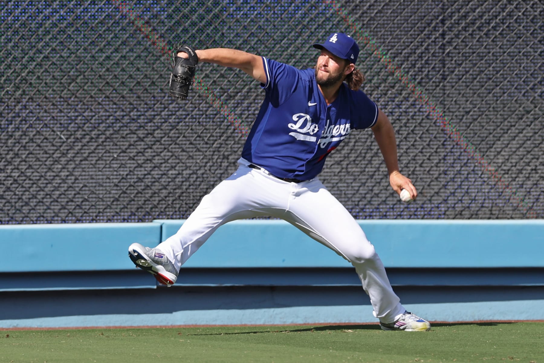 LOS ANGELES, CA - OCTOBER 09: Clayton Kershaw #22 of the Los Angeles Dodgers warms up prior to Game 2 of the Division Series between the Arizona Diamondbacks and the Los Angeles Dodgers at Dodger Stadium on Monday, October 9, 2023 in Los Angeles, California. (Photo by Rob Leiter/MLB Photos via Getty Images)