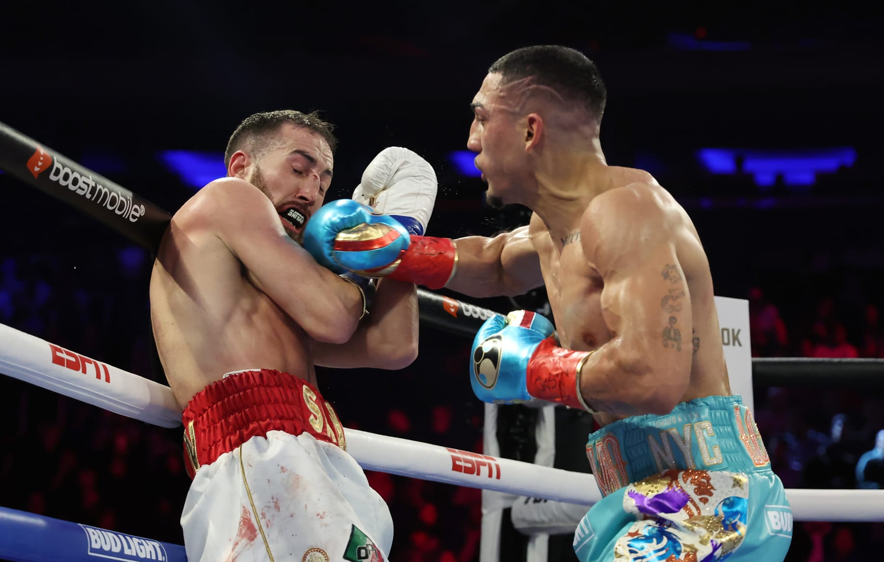 NEW YORK, NEW YORK - DECEMBER 10: Teofimo Lopez punchesSandor Martin during their junior welterweight bout at Madison Square Garden on December 10, 2022 in New York City. (Photo by Al Bello/Getty Images)