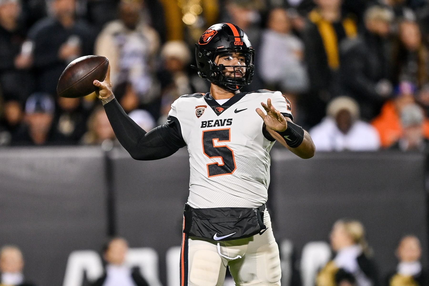 BOULDER, CO - NOVEMBER 4:  Quarterback DJ Uiagalelei #5 of the Oregon State Beavers passes against the Colorado Buffaloes in the first quarter at Folsom Field on November 4, 2023 in Boulder, Colorado. (Photo by Dustin Bradford/Getty Images)