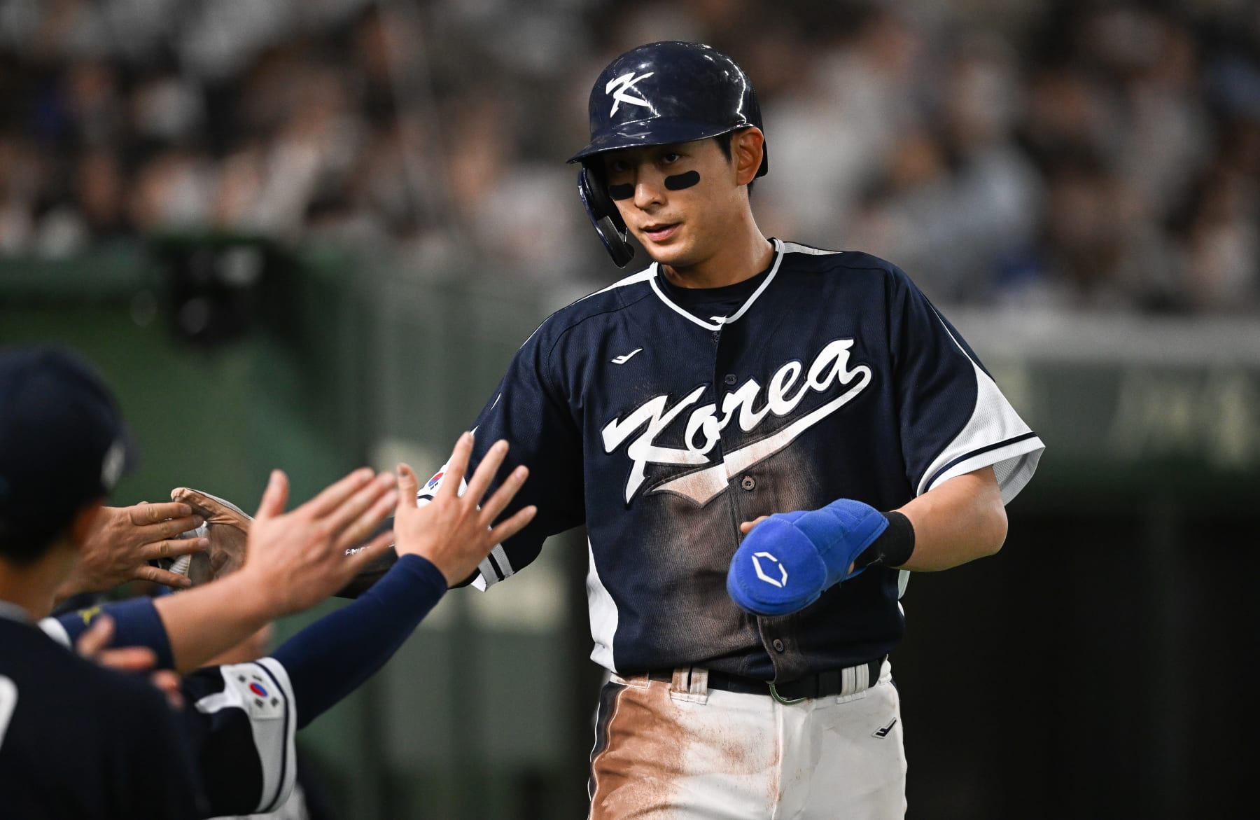 TOKYO, JAPAN - MARCH 13: Jung Hoo Lee #51 of Team Korea scores after Baekho Kang #50 of Team Korea hit a RBI single at the top of the first inning during the World Baseball Classic Pool B game between Korea and China at Tokyo Dome on March 13, 2023 in Tokyo, Japan. (Photo by Gene Wang/Getty Images)
