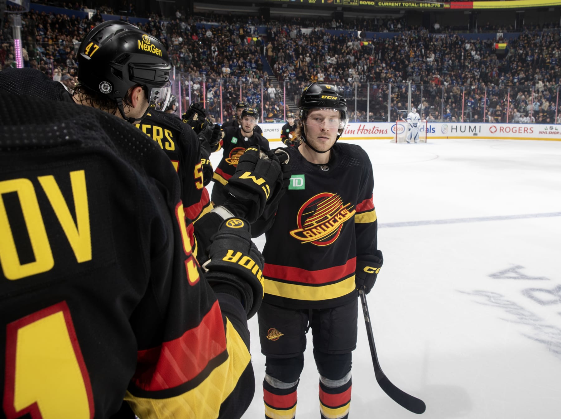 VANCOUVER, CANADA - DECEMBER 12: Brock Boeser #6 of the Vancouver Canucks celebrates his goal with teammates during the second period of their NHL game against the Tampa Bay Lightningat Rogers Arena on December 12, 2023 in Vancouver, British Columbia, Canada. (Photo by Jeff Vinnick/NHLI via Getty Images)