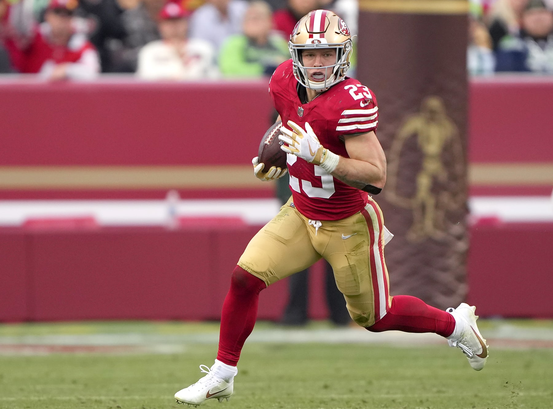SANTA CLARA, CALIFORNIA - DECEMBER 10: Christian McCaffrey #23 of the San Francisco 49ers carries the ball against the Seattle Seahawks during the fourth quarter of an NFL football game at Levi's Stadium on December 10, 2023 in Santa Clara, California. (Photo by Thearon W. Henderson/Getty Images)