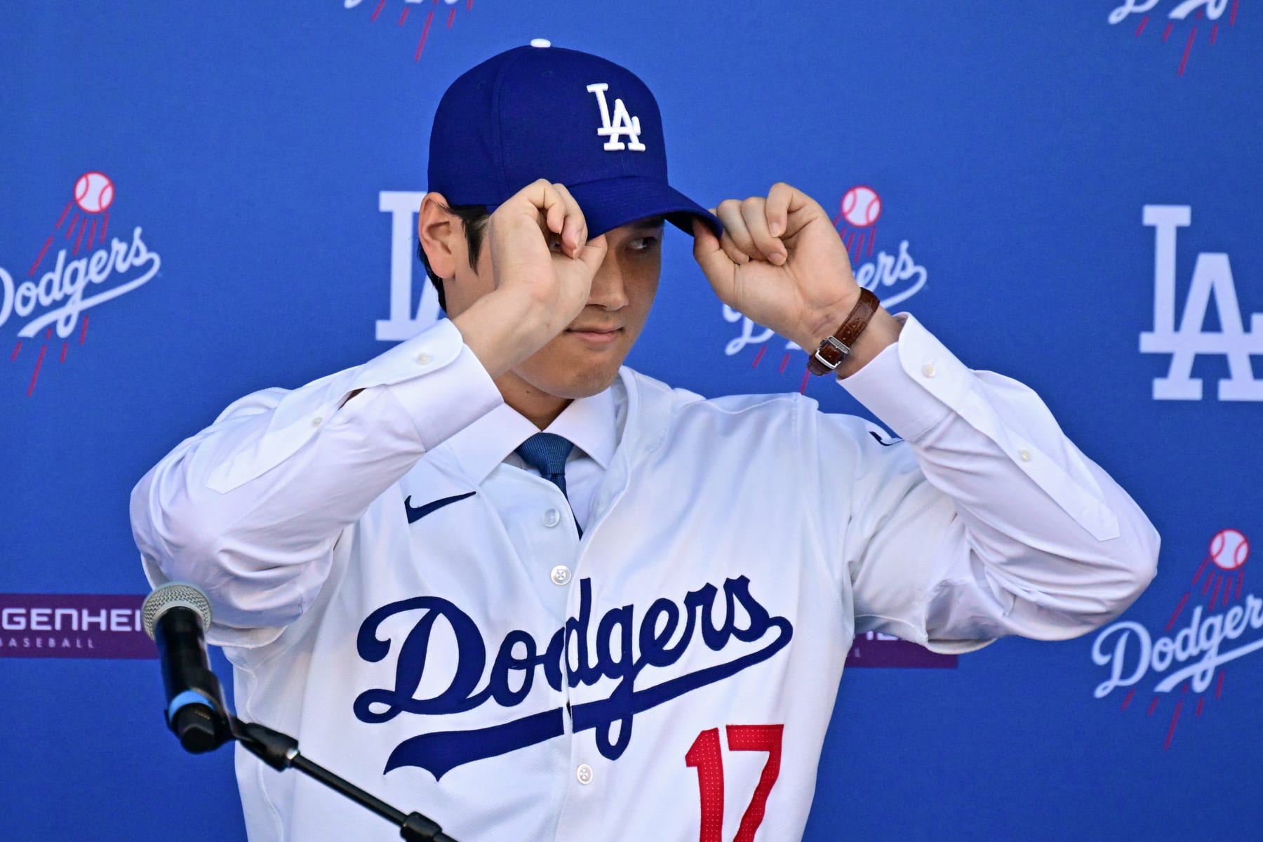 Japanese baseball player Shohei Ohtani attends a press conference on his presentation after signing a ten-year deal with the Los Angeles Dodgers at Dodgers Stadium in Los Angeles, California on December 14, 2023. Ohtani has signed a record-shattering $700 million deal with the Los Angeles Dodgers, the richest in North American sports history. (Photo by Frederic J. Brown / AFP) (Photo by FREDERIC J. BROWN/AFP via Getty Images)