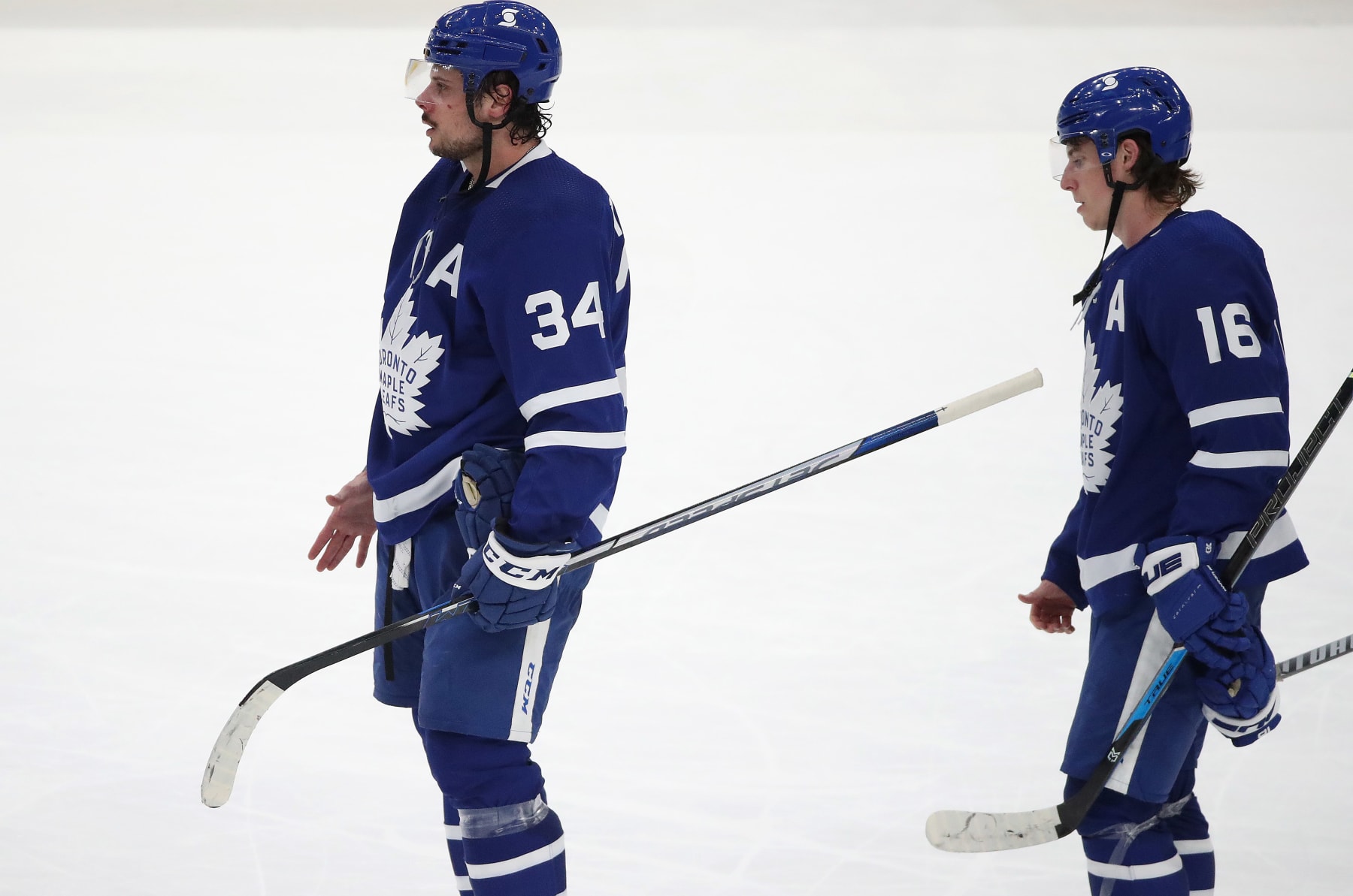 Toronto, ON- May 31 - Toronto Maple Leafs center Auston Matthews (34) and Toronto Maple Leafs center Mitchell Marner (16) line up for hand shakes as the Toronto Maple Leafs fall to the Montreal Canadiens 3-1 in game seven in the first round of the NHL play-offs at Scotiabank Arena in Toronto. May 31, 2021. (Steve Russell/Toronto Star via Getty Images)