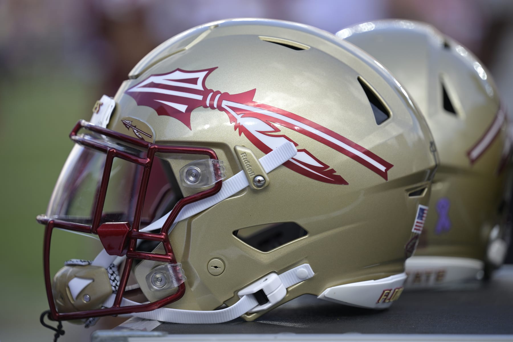 Florida State helmets are viewed on the sideline during the second half of an NCAA college football game against Syracuse, Saturday, Oct. 14, 2023, in Tallahassee, Fla. (AP Photo/Phelan M. Ebenhack)