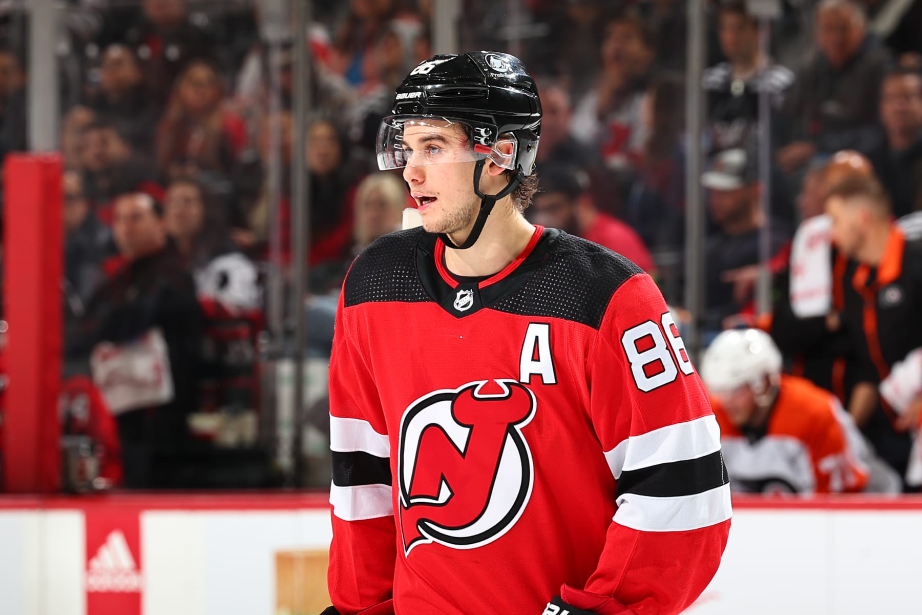 NEWARK, NJ - DECEMBER 19: Jack Hughes #86 of the New Jersey Devils skates in the first period of the game against the Philadelphia Flyers at the Prudential Center on December 19, 2023 in Newark, New Jersey. (Photo by Rich Graessle/NHLI via Getty Images)
