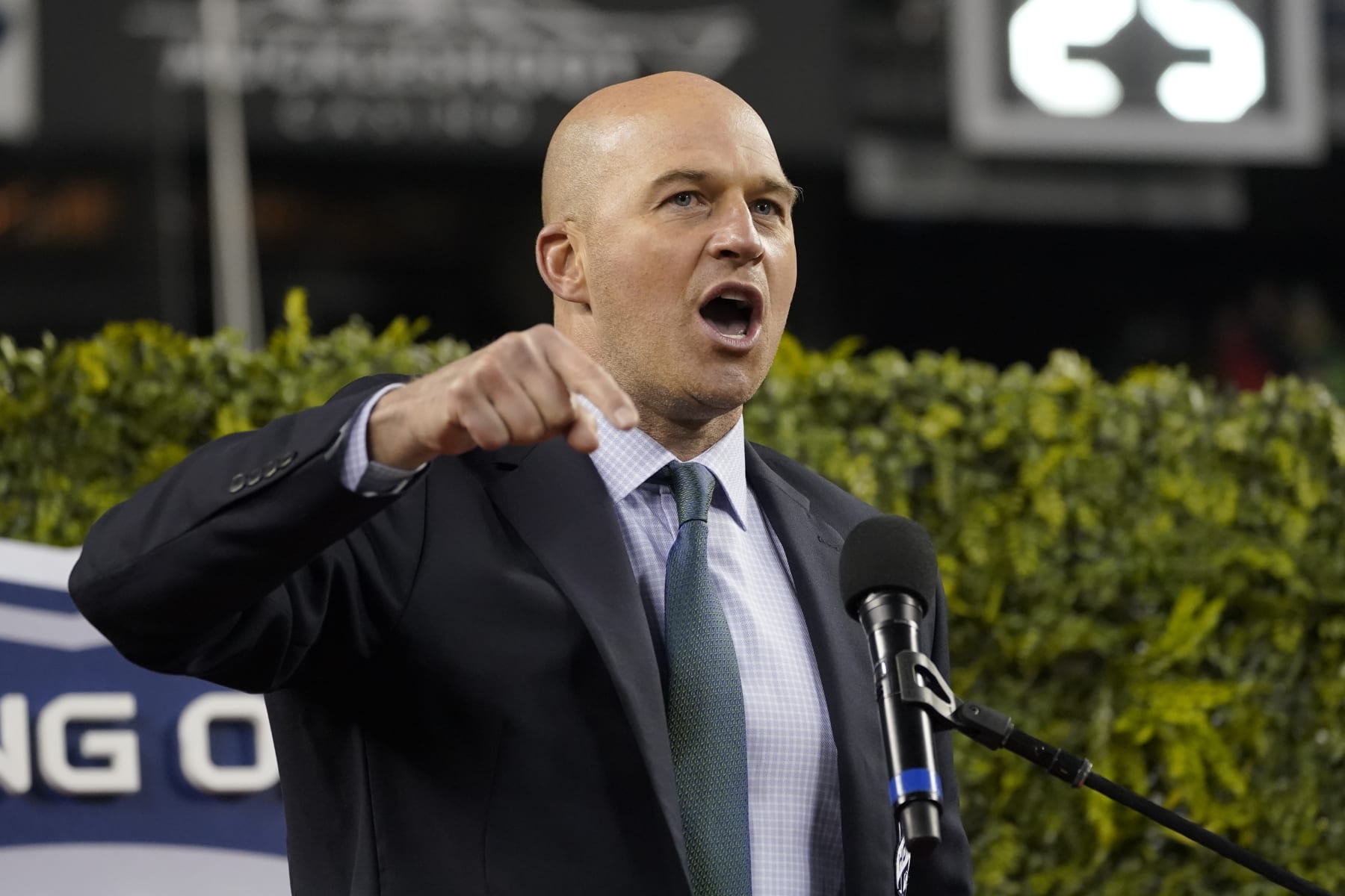 Former Seattle Seahawks quarterback Matt Hasselbeck motions while speaking after being introduced as one of the team's newest members of the team's "Ring of Honor" during halftime of an NFL football game against the New Orleans Saints, Monday, Oct. 25, 2021, in Seattle. (AP Photo/Ted S. Warren)
