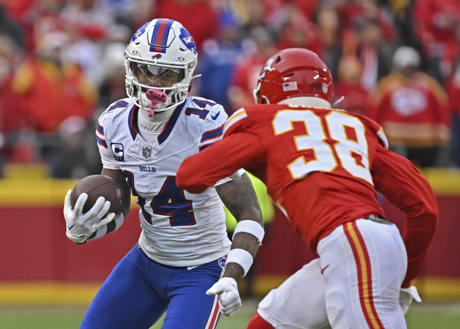 Buffalo Bills wide receiver Stefon Diggs (14) runs up field with the ball against Kansas City Chiefs cornerback L'Jarius Sneed (38) during an NFL football game against Sunday, Dec. 10, 2023, in Kansas City, Mo. (AP Photo/Peter Aiken)