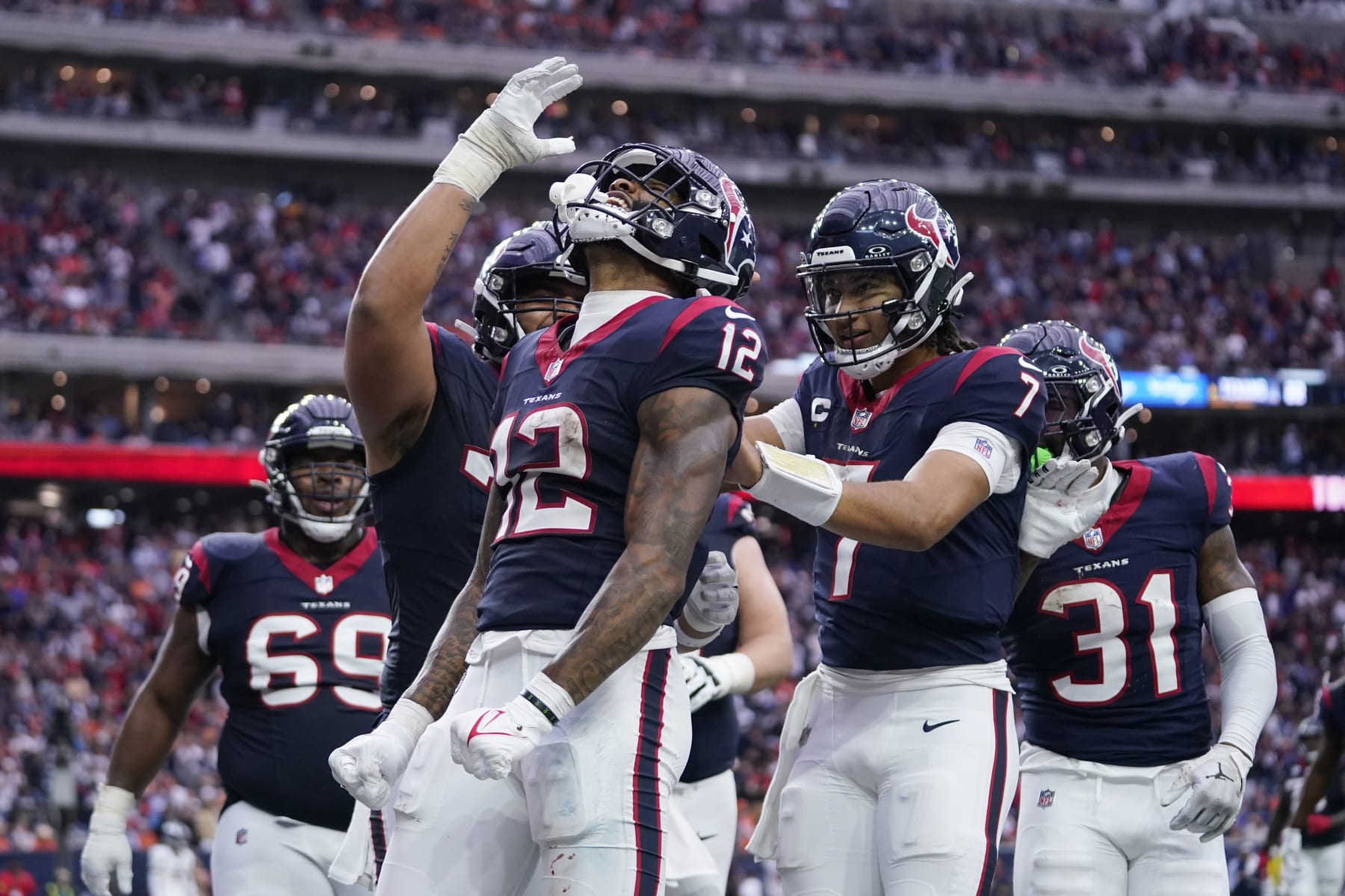 Houston Texans wide receiver Nico Collins (12) celebrates after catching a touchdown pass against the Denver Broncos in the second half of an NFL football game Sunday, Dec. 3, 2023, in Houston. (AP Photo/Eric Christian Smith)