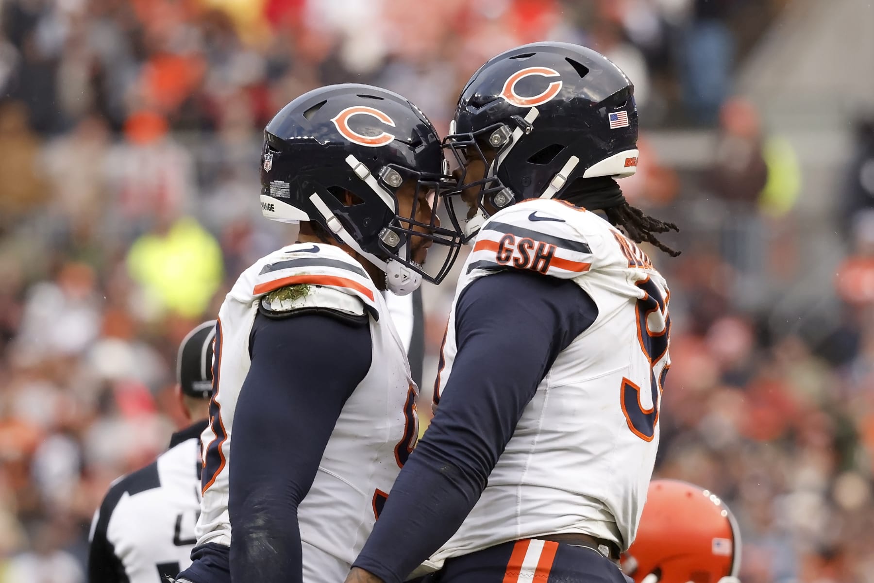 Chicago Bears defensive lineman Montez Sweat (98) and defensive lineman Gervon Dexter Sr. (99) react after making a defensive stop during an NFL football game against the Cleveland Browns, Sunday, Dec. 17, 2023, in Cleveland. (AP Photo/Kirk Irwin)