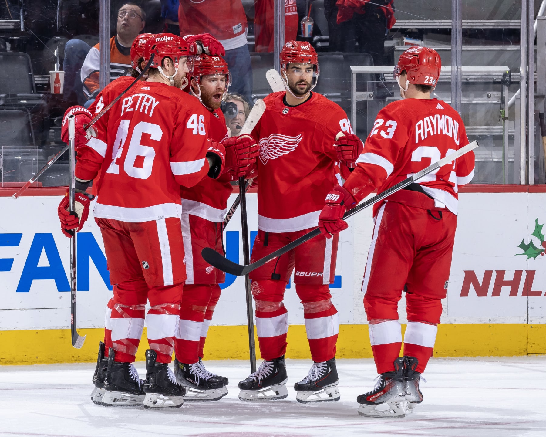 DETROIT, MI - DECEMBER 22: J.T. Compher #37 of the Detroit Red Wings celebrates his goal with teammates during the first period against the Philadelphia Flyers at Little Caesars Arena on December 22, 2023 in Detroit, Michigan. (Photo by Dave Reginek/NHLI via Getty Images)