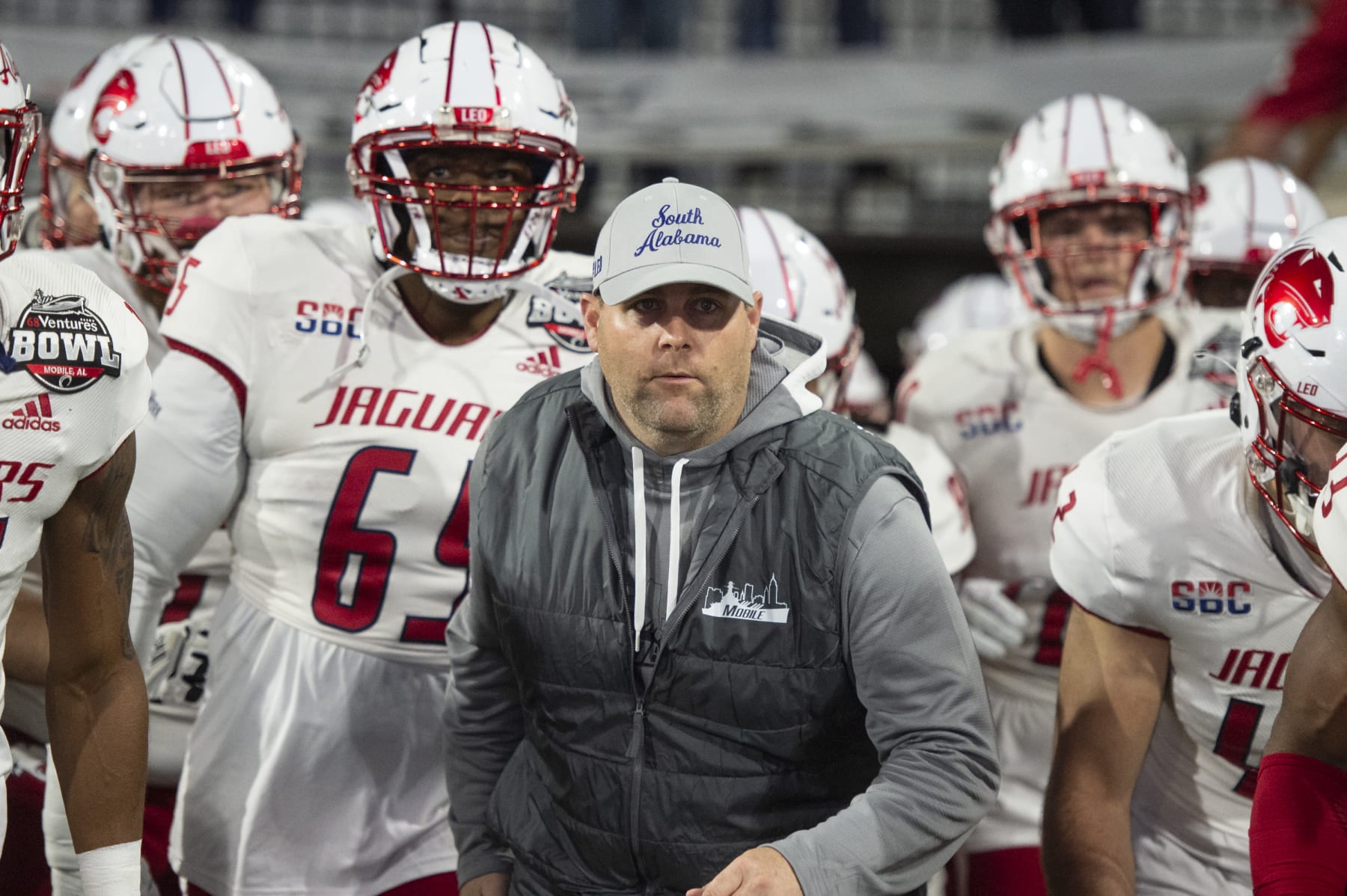 MOBILE, ALABAMA - DECEMBER 23: Head coach Kane Wommack of the South Alabama Jaguars leads his team on to the field prior to their game against the Eastern Michigan Eagles in the 68 Ventures Bowl at Hancock Whitney Stadium on December 23, 2023 in Mobile, Alabama. (Photo by Michael Chang/Getty Images)
