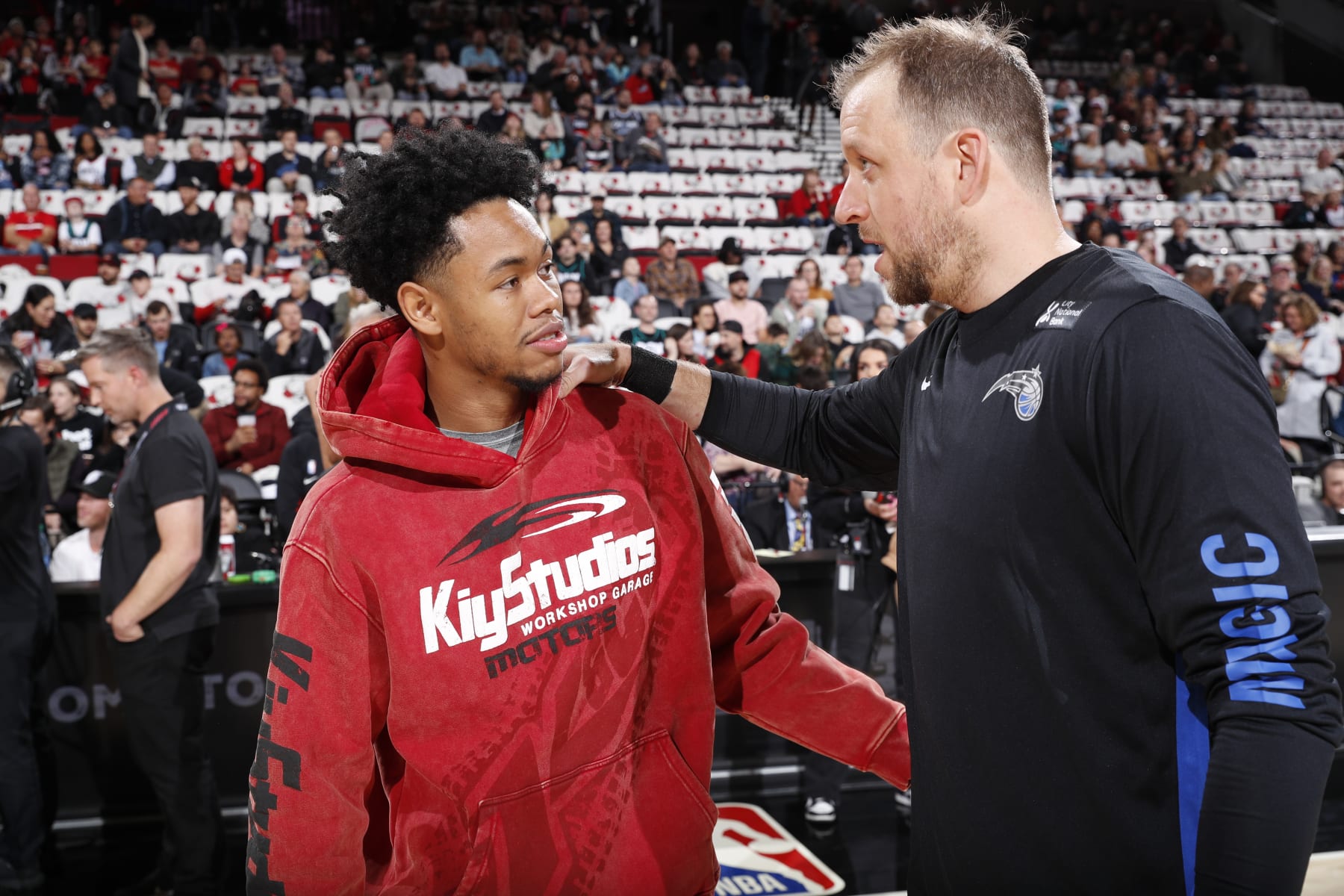 PORTLAND, OR - OCTOBER 27: Anfernee Simons #1 of the Portland Trail Blazers talks with Joe Ingles #7 of the Orlando Magic before the game on October 27, 2023 at the Moda Center Arena in Portland, Oregon. NOTE TO USER: User expressly acknowledges and agrees that, by downloading and or using this photograph, user is consenting to the terms and conditions of the Getty Images License Agreement. Mandatory Copyright Notice: Copyright 2023 NBAE (Photo by Cameron Browne/NBAE via Getty Images)