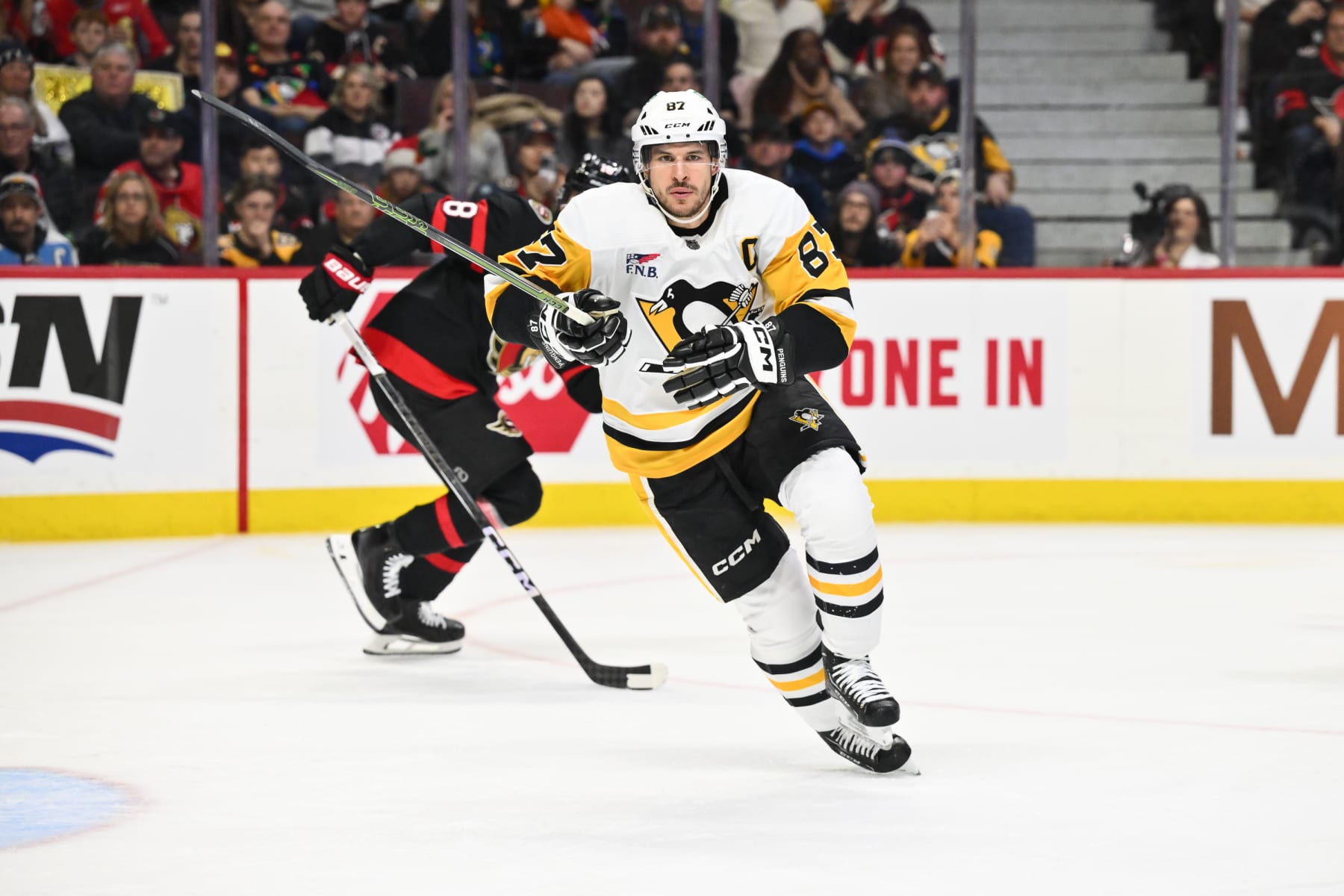 OTTAWA, CANADA - DECEMBER 23: Sidney Crosby #87 of the Pittsburgh Penguins skates during the third period against the Ottawa Senators at Canadian Tire Centre on December 23, 2023 in Ottawa, Ontario, Canada. The Ottawa Senators defeated the Pittsburgh Penguins 5-4 in overtime. (Photo by Minas Panagiotakis/Getty Images)