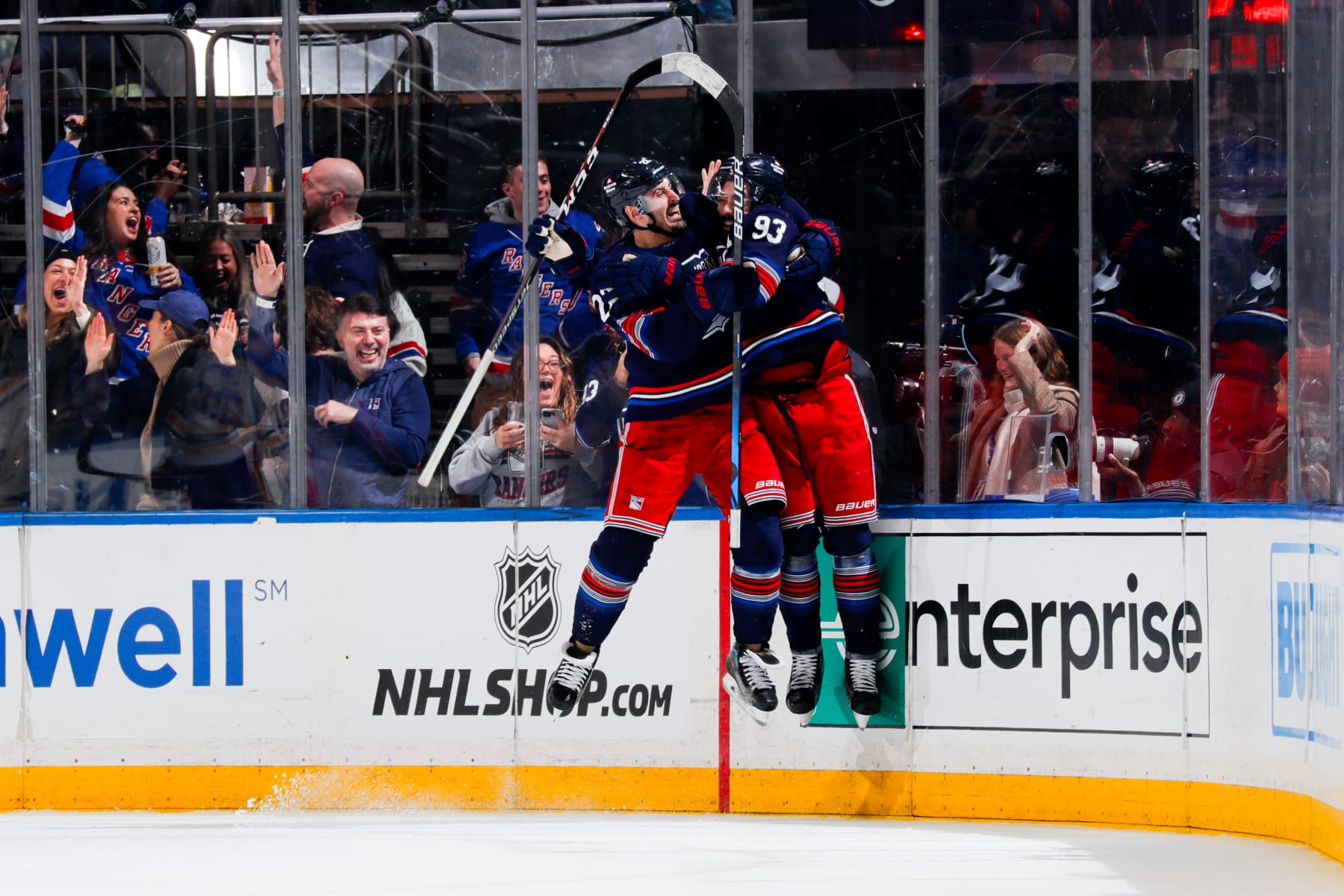 NEW YORK, NEW YORK - DECEMBER 23: Chris Kreider #20 and Mika Zibanejad #93 of the New York Rangers celebrate after the game winning goal in overtime against the Buffalo Sabres at Madison Square Garden on December 23, 2023 in New York City. (Photo by Jared Silber/NHLI via Getty Images)