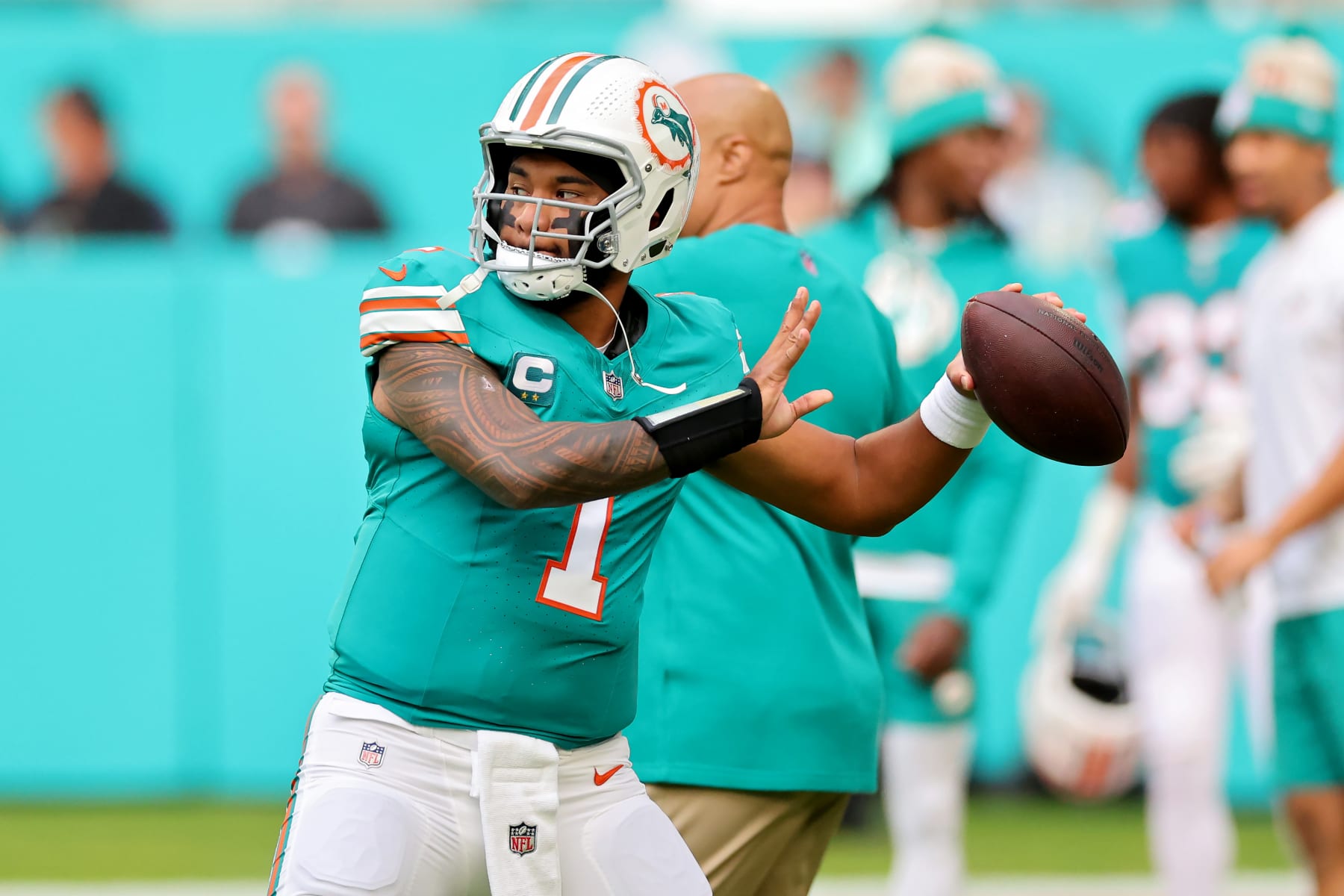 MIAMI GARDENS, FLORIDA - DECEMBER 24: Tua Tagovailoa #1 of the Miami Dolphins warms up prior to the game against the Dallas Cowboys at Hard Rock Stadium on December 24, 2023 in Miami Gardens, Florida. (Photo by Stacy Revere/Getty Images)