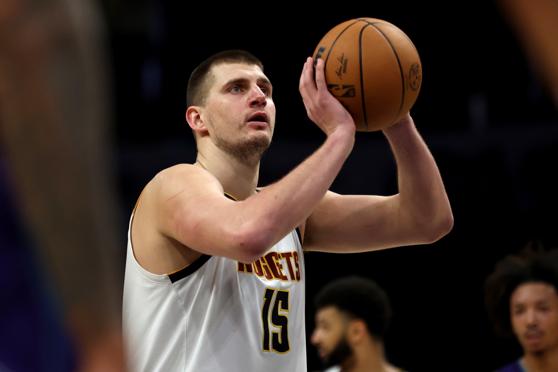 CHARLOTTE, NORTH CAROLINA - DECEMBER 23: Nikola Jokic #15 of the Denver Nuggets shoots a free throw during the second half of an NBA game against the Charlotte Hornets at Spectrum Center on December 23, 2023 in Charlotte, North Carolina. NOTE TO USER: User expressly acknowledges and agrees that, by downloading and or using this photograph, User is consenting to the terms and conditions of the Getty Images License Agreement. (Photo by David Jensen/Getty Images)