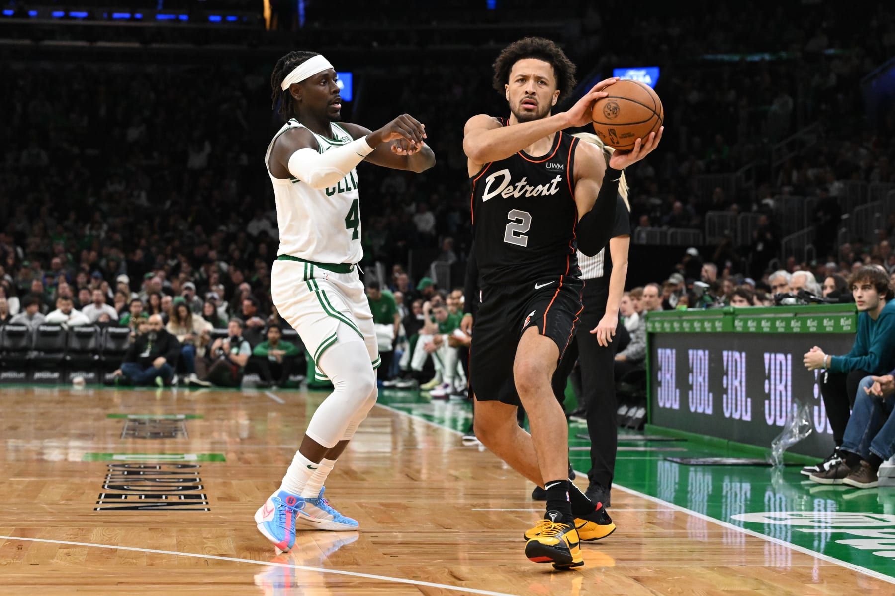 BOSTON, MASSACHUSETTS - DECEMBER 28: Cade Cunningham #2 of the Detroit Pistons passes the ball against Jrue Holiday #4 of the Boston Celtics during the third quarter at TD Garden on December 28, 2023 in Boston, Massachusetts. NOTE TO USER: User expressly acknowledges and agrees that, by downloading and or using this photograph, User is consenting to the terms and conditions of the Getty Images License Agreement. (Photo by Brian Fluharty/Getty Images)