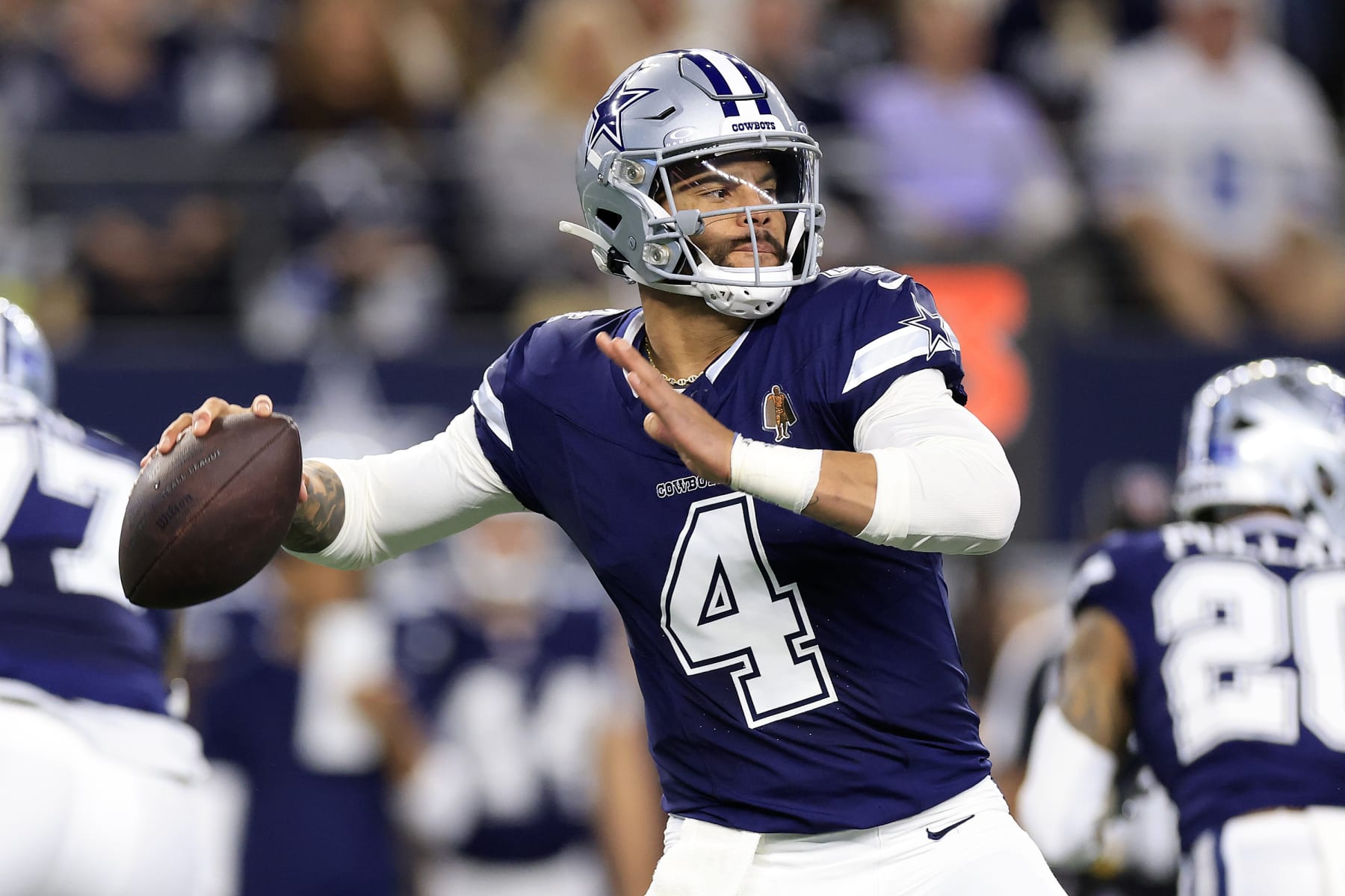 ARLINGTON, TEXAS - DECEMBER 30: Dak Prescott #4 of the Dallas Cowboys throws a pass against the Detroit Lions during the first quarter in the game at AT&T Stadium on December 30, 2023 in Arlington, Texas. (Photo by Ron Jenkins/Getty Images)