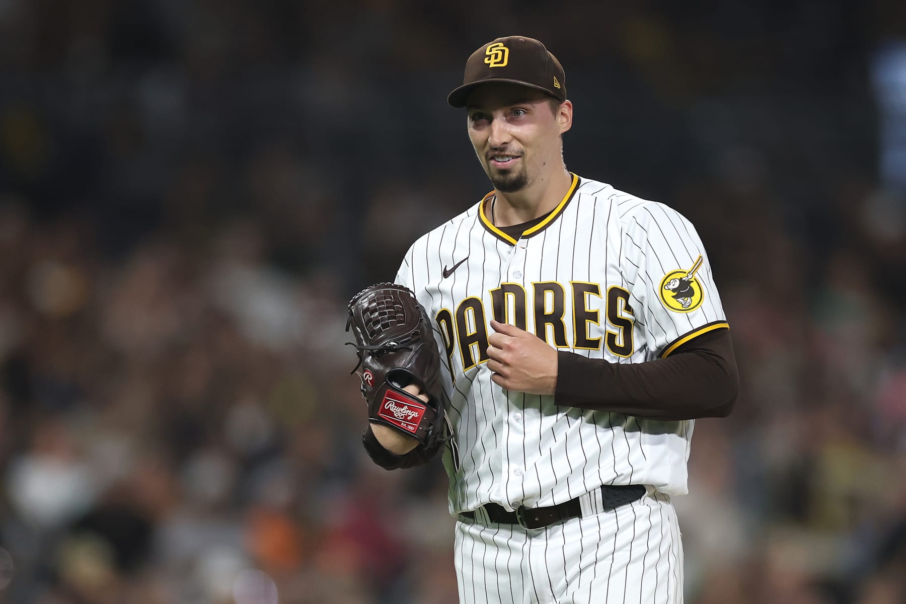 SAN DIEGO, CALIFORNIA - SEPTEMBER 19: Blake Snell #4 of the San Diego Padres reacts as he walks to the dugout after throwing seven hitless innings a game against the Colorado Rockies at PETCO Park on September 19, 2023 in San Diego, California. (Photo by Sean M. Haffey/Getty Images)