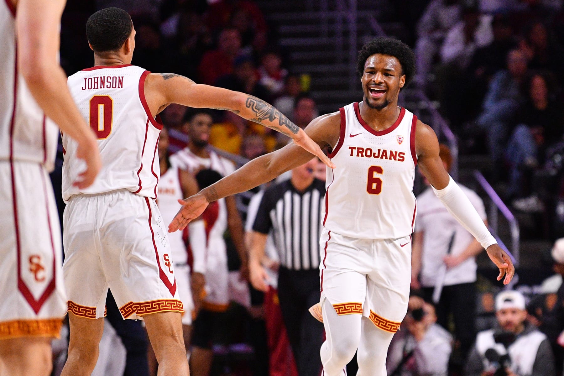 LOS ANGELES, CA - JANUARY 03: USC Trojans guard Bronny James (6) celebrates with USC Trojans guard Kobe Johnson (0) after a basket during the college basketball game between the California Bears and the USC Trojans on January 3, 2023 at Galen Center in Los Angeles, CA. (Photo by Brian Rothmuller/Icon Sportswire via Getty Images)