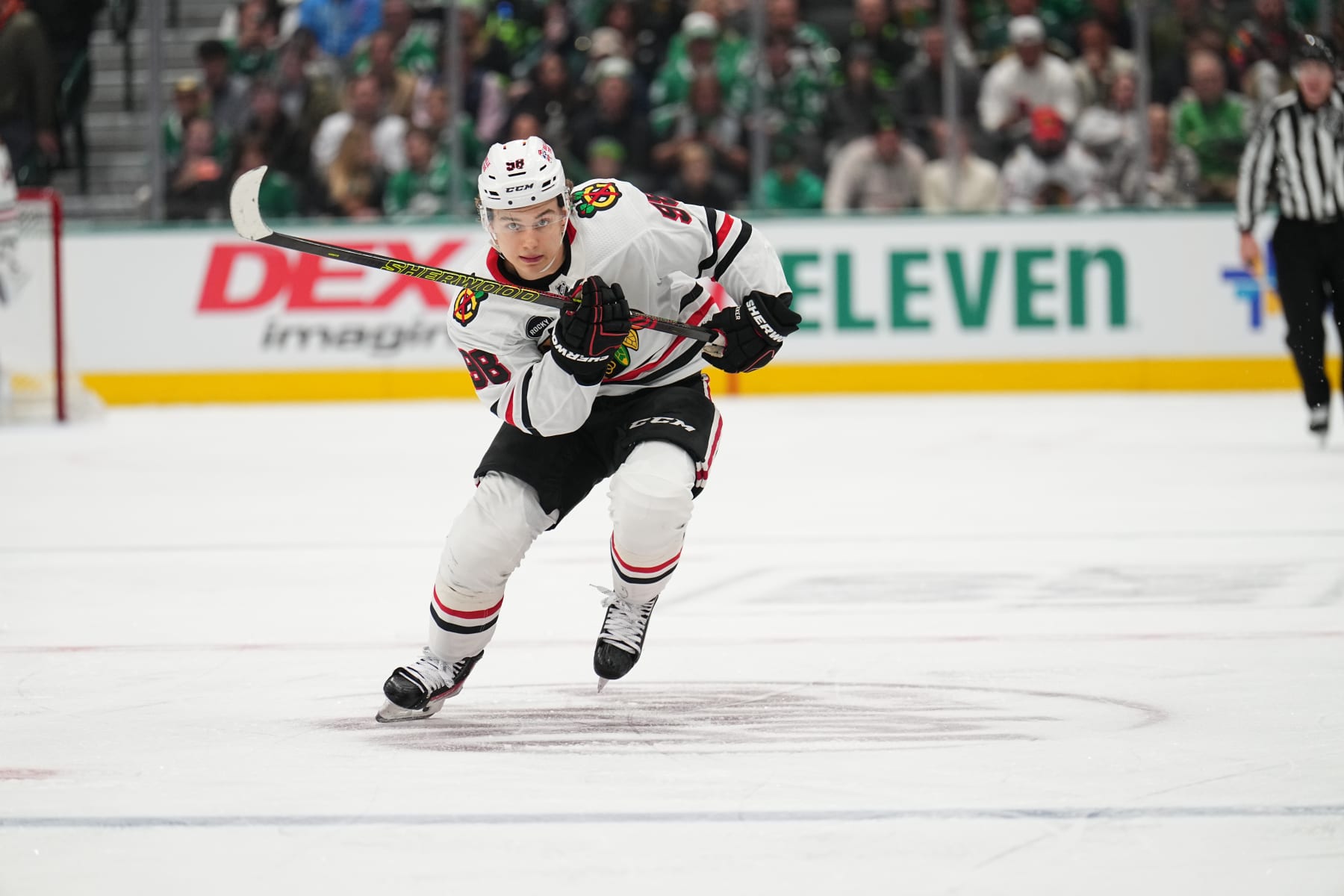 DALLAS, TX - DECEMBER 29: Connor Bedard #98 of the Chicago Blackhawks skates against the Dallas Stars at the American Airlines Center on December 29, 2023 in Dallas, Texas. (Photo by Glenn James/NHLI via Getty Images)
