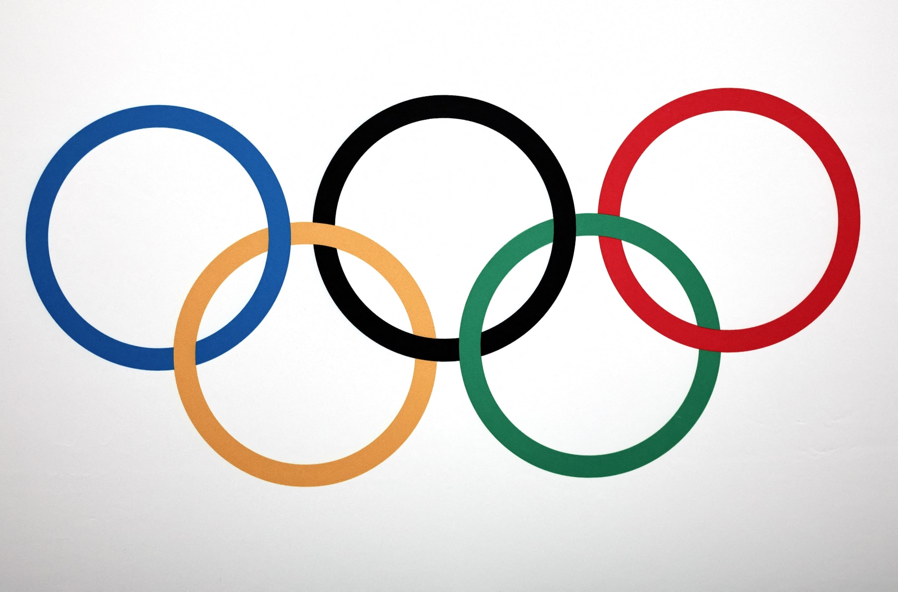 A photo shows the Olympic rings logo during a press conference after an International Olympic Committee (IOC) Executive Board committee meeting in Paris, on November 30, 2023. (Photo by FRANCK FIFE / AFP) (Photo by FRANCK FIFE/AFP via Getty Images)