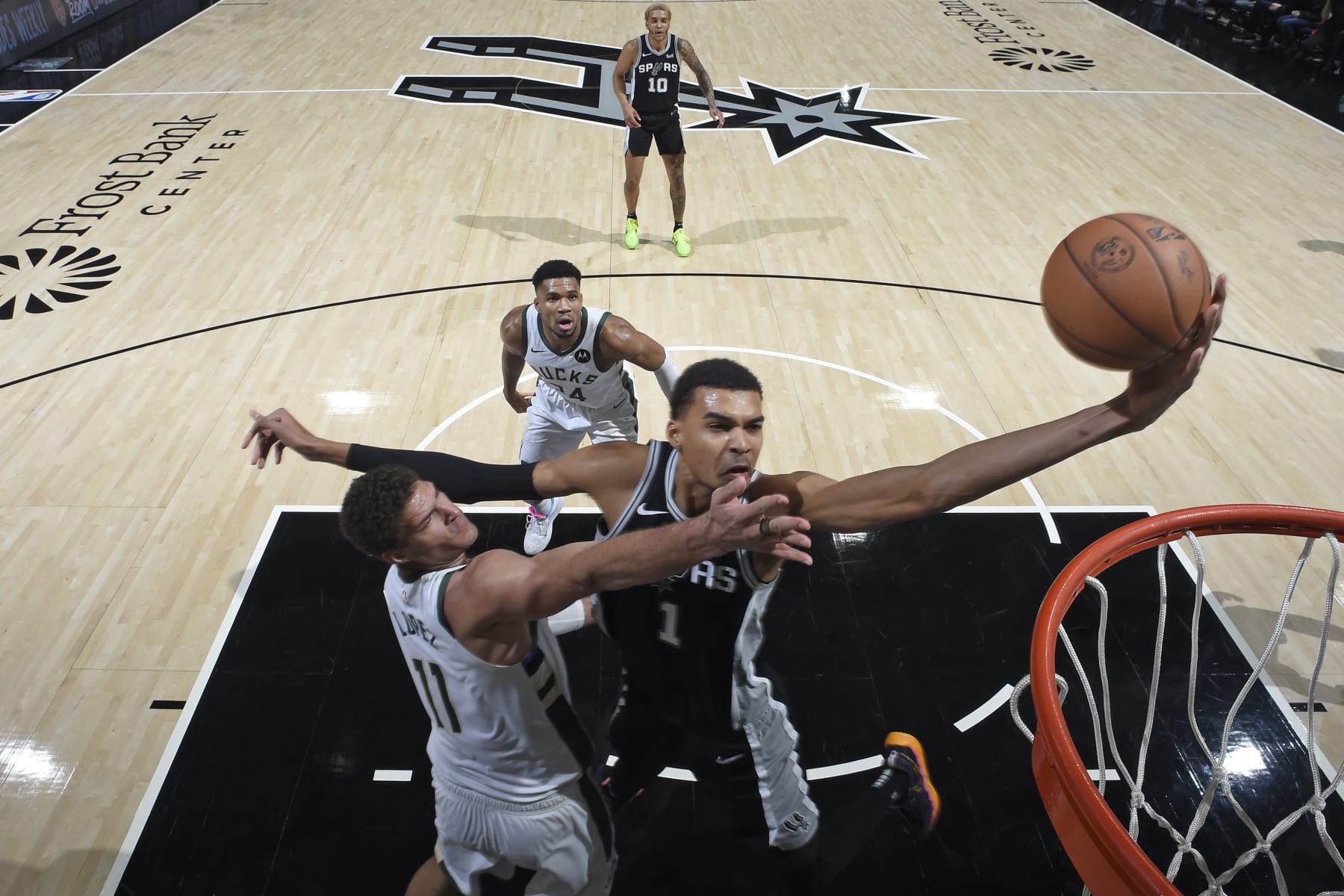 SAN ANTONIO, TX - JANUARY 4: Victor Wembanyama #1 of the San Antonio Spurs drives to the basket during the game against the Milwaukee Bucks on January 4, 2024 at the Frost Bank Center in San Antonio, Texas. NOTE TO USER: User expressly acknowledges and agrees that, by downloading and or using this photograph, User is consenting to the terms and conditions of the Getty Images License Agreement. Mandatory Copyright Notice: Copyright 2024 NBAE (Photo by Logan Riely/NBAE via Getty Images)