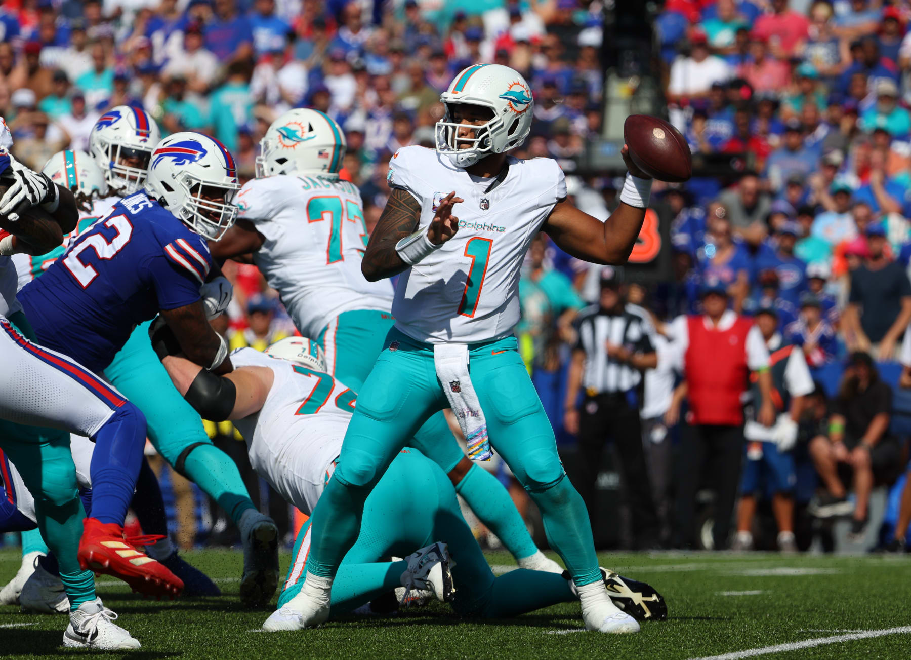 ORCHARD PARK, NEW YORK - OCTOBER 1: Tua Tagovailoa #1 of the Miami Dolphins looks to throw a pass against the Buffalo Bills at Highmark Stadium on October 1, 2023 in Orchard Park, New York. (Photo by Timothy T Ludwig/Getty Images)