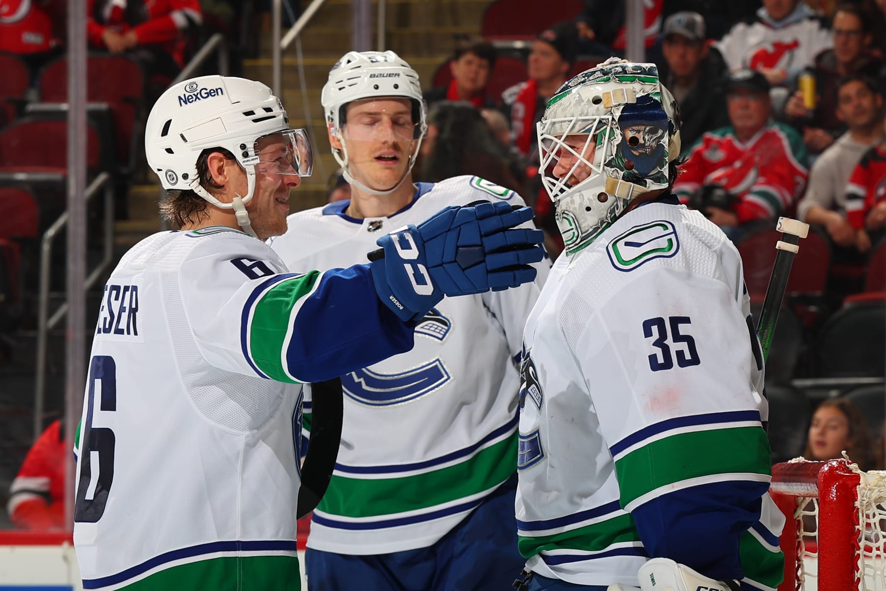 NEWARK, NJ - JANUARY 06: Thatcher Demko #35 of the Vancouver Canucks celebrates with Brock Boeser #6 after winning the game against the New Jersey Devils at the Prudential Center on January 6, 2024 in Newark, New Jersey. (Photo by Rich Graessle/NHLI via Getty Images)