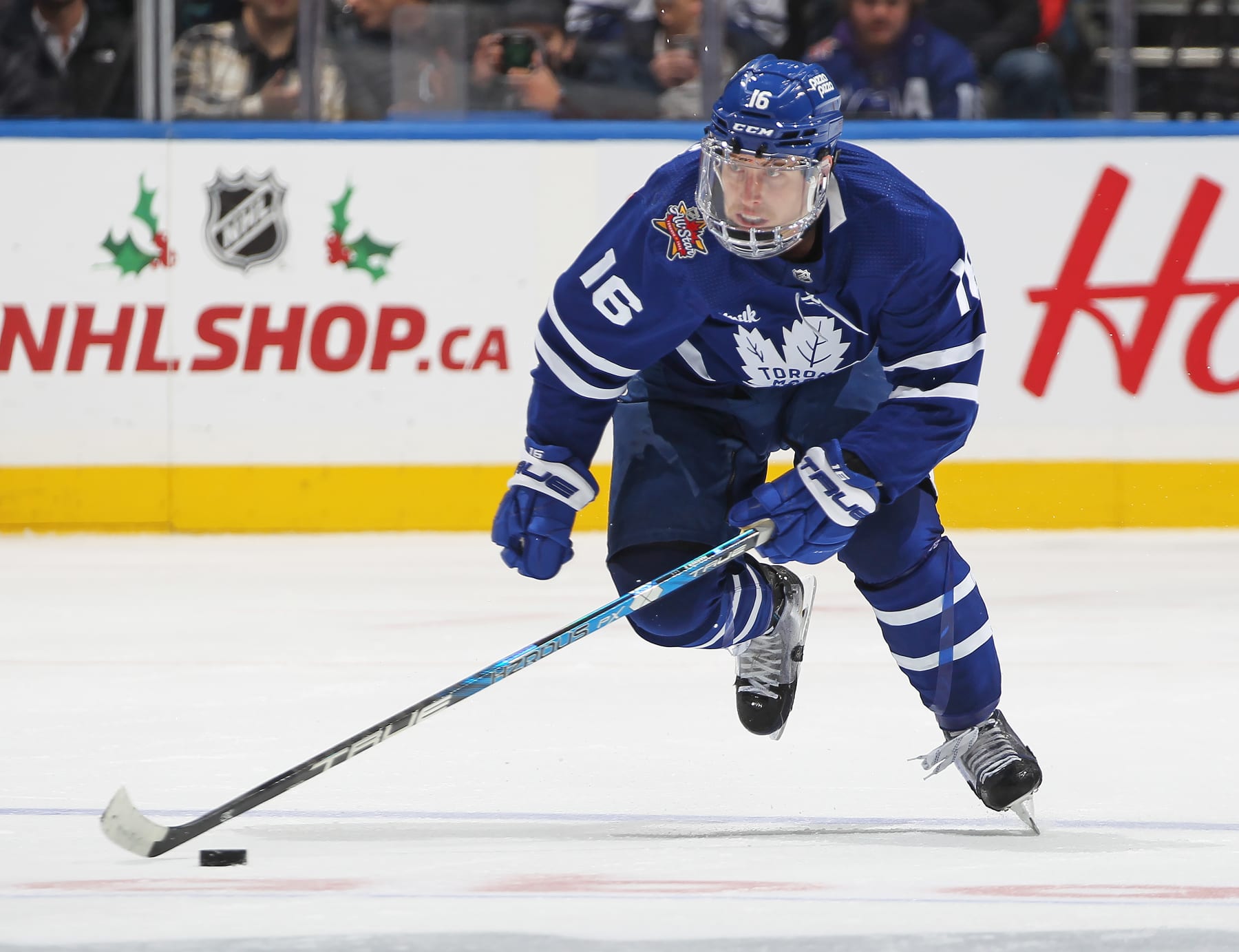 TORONTO, CANADA - NOVEMBER 30: Mitchell Marner #16 of the Toronto Maple Leafs heads up ice with the puck against the Seattle Kraken during the third period in an NHL game at Scotiabank Arena on November 30, 2023 in Toronto, Ontario, Canada. The Maple Leafs defeated the Kraken 4-3 in a shootout. (Photo by Claus Andersen/Getty Images)