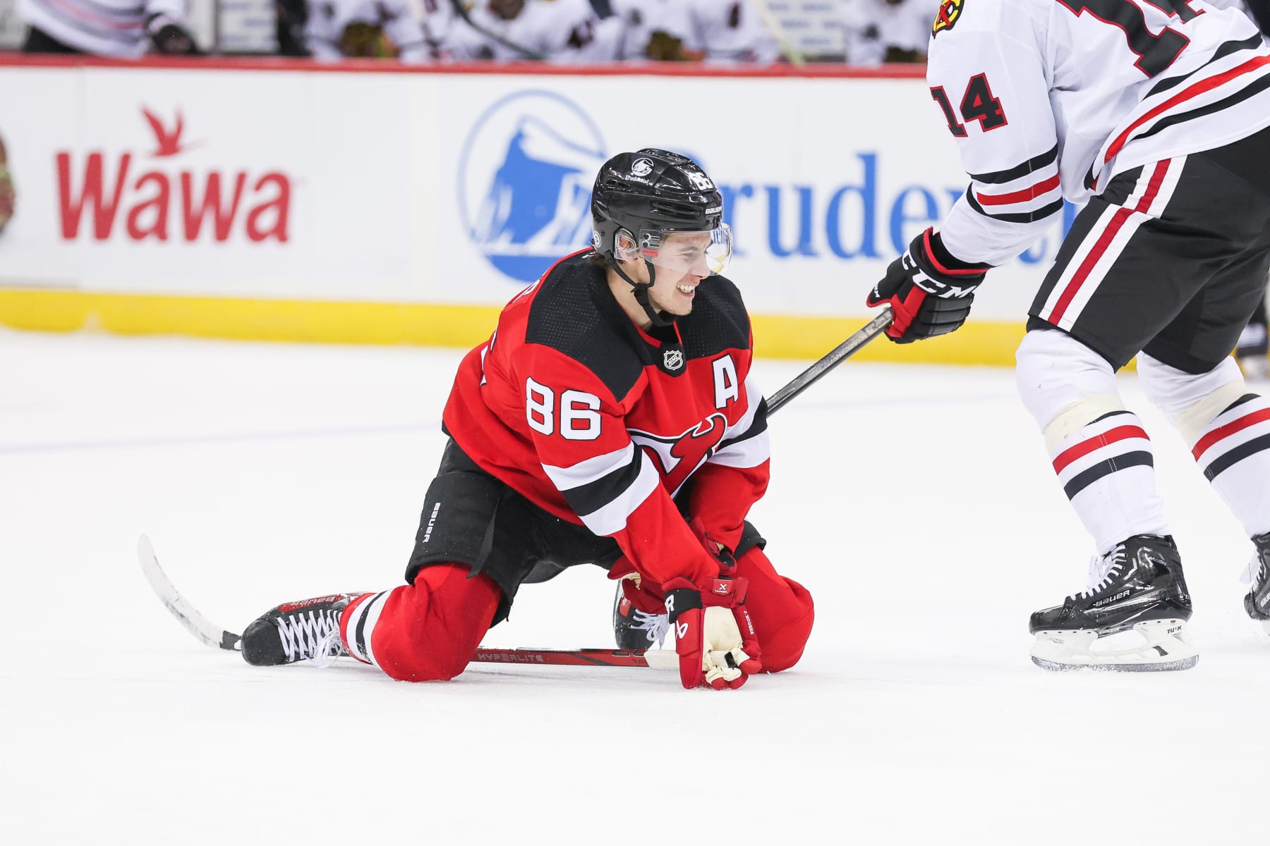 NEWARK, NJ - JANUARY 05: New Jersey Devils center Jack Hughes (86) falls on the ice during a game between the Chicago Blackhawks and New Jersey Devils on January 05, 2024 at Prudential Center in the Newark, New Jersey. (Photo by Andrew Mordzynski/Icon Sportswire via Getty Images)