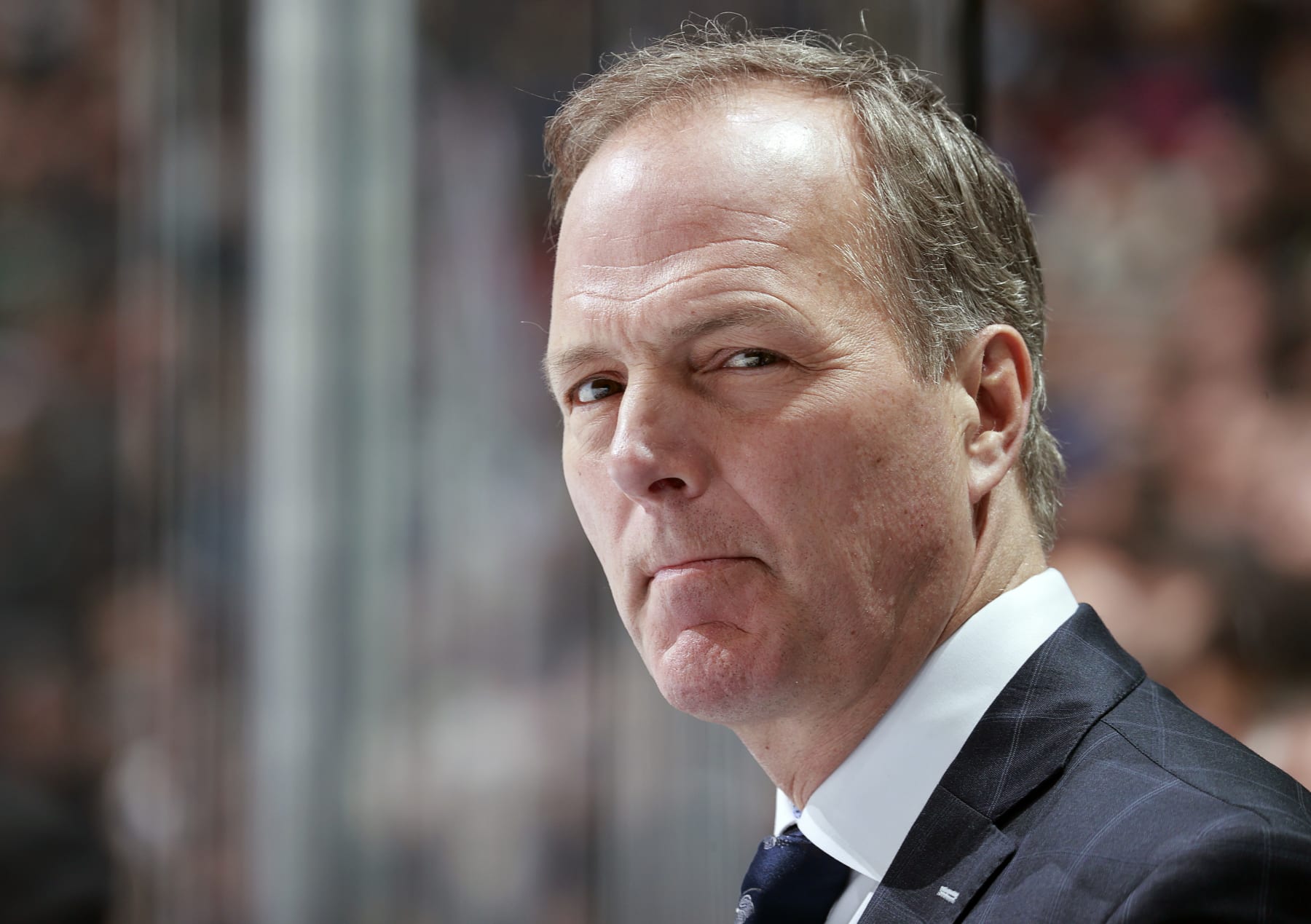 VANCOUVER, CANADA - DECEMBER 12: Head coach Jon Cooper of the Tampa Bay Lightning looks on from the bench during their NHL game against the Vancouver Canucks at Rogers Arena on December 12, 2023 in Vancouver, British Columbia, Canada. (Photo by Jeff Vinnick/NHLI via Getty Images)