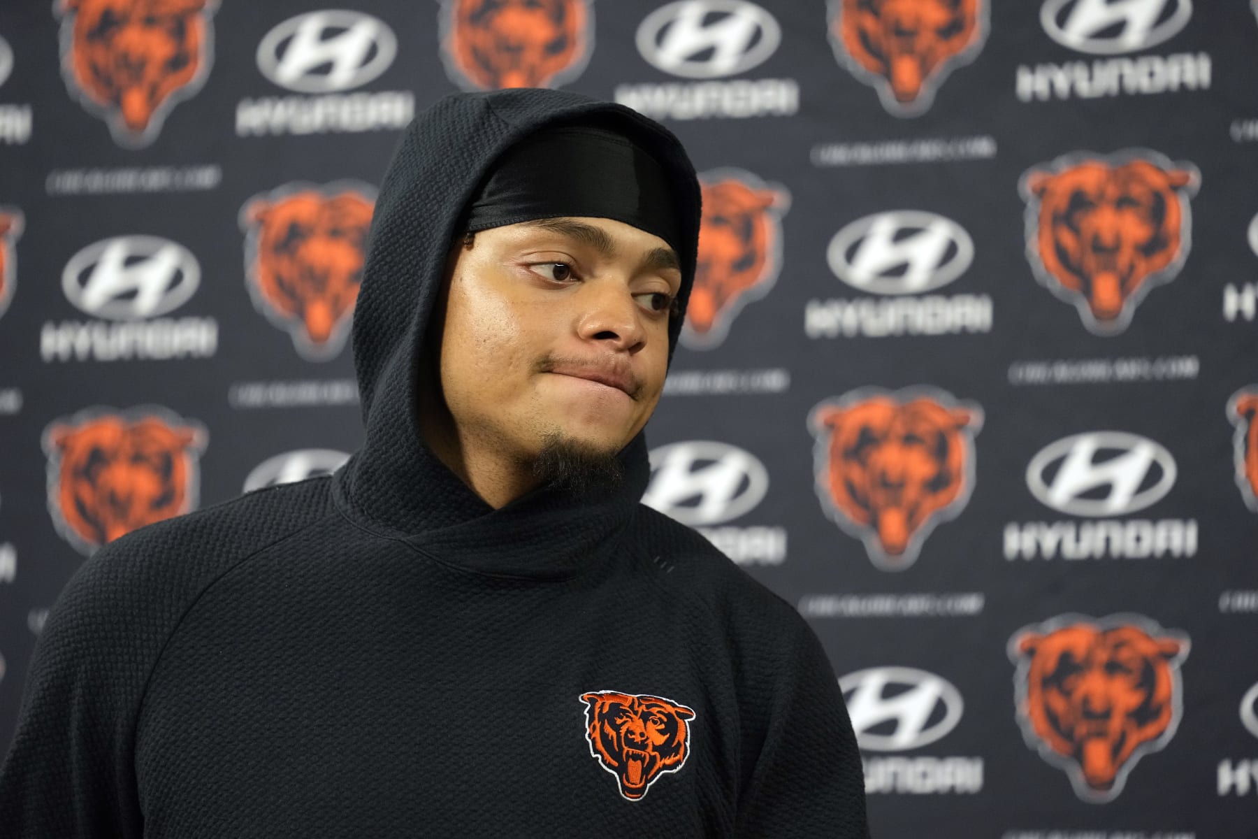 GREEN BAY, WISCONSIN - JANUARY 07: Justin Fields #1 of the Chicago Bears speaks during a press conference after a game against the Green Bay Packers at Lambeau Field on January 07, 2024 in Green Bay, Wisconsin. (Photo by Patrick McDermott/Getty Images)