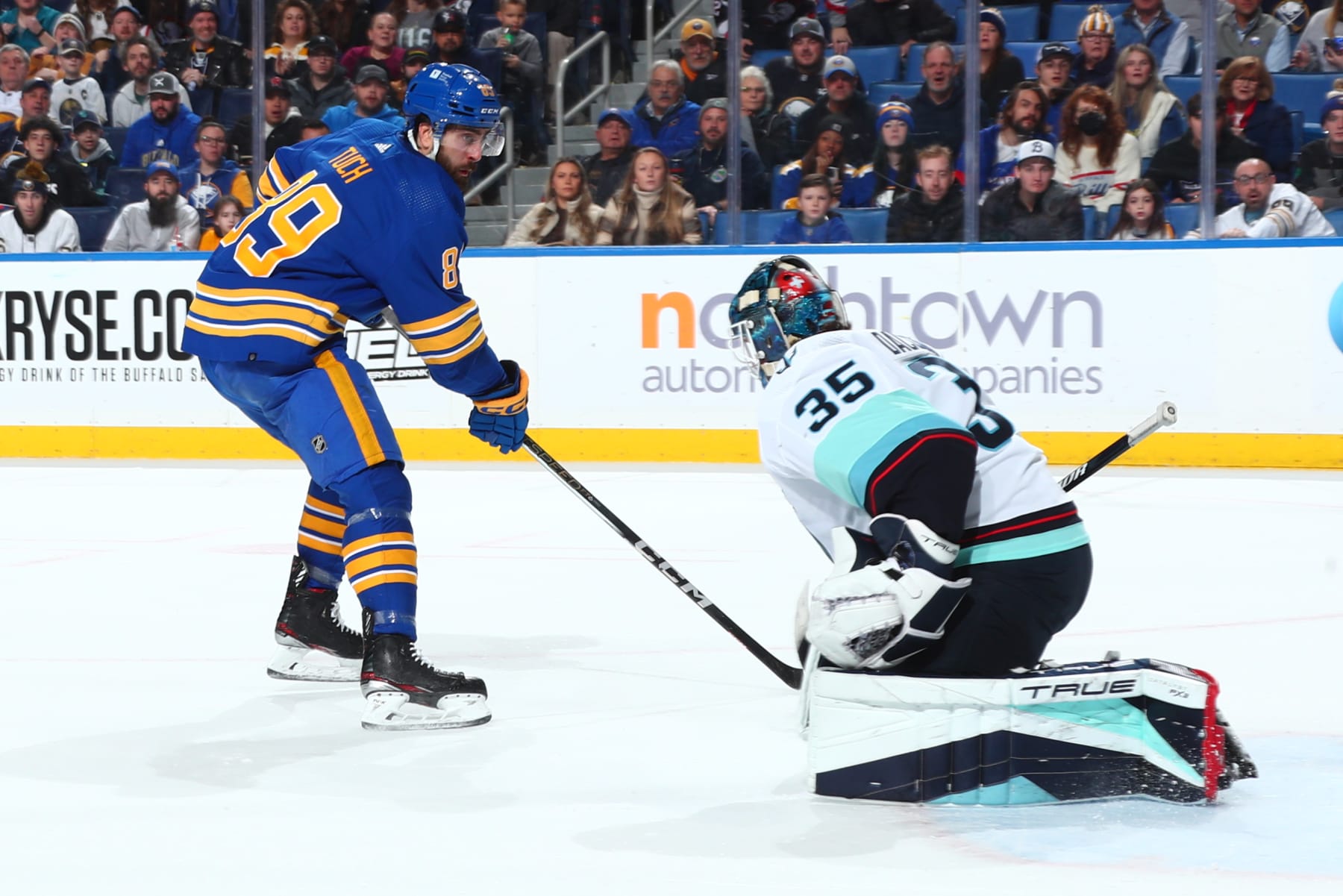 BUFFALO, NEW YORK - JANUARY 9: Joey Daccord #35 of the Seattle Kraken makes a save against Alex Tuch #89 of the Buffalo Sabres during an NHL game on January 9, 2024 at KeyBank Center in Buffalo, New York. (Photo by Bill Wippert/NHLI via Getty Images)
