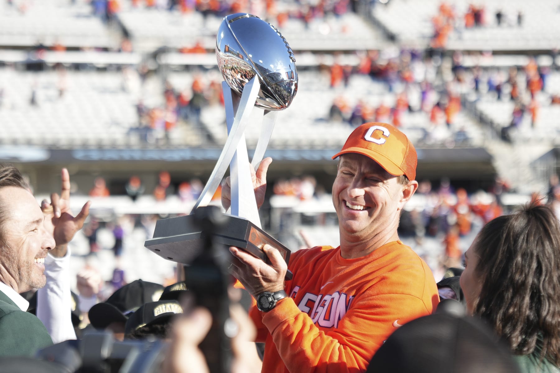 JACKSONVILLE, FL - DECEMBER 29: Clemson Tigers head coach Dabo Swinney hold up the game trophy following rhe TaxSlayer Gator Bowl between the Clemson Tigers and the Kentucky Wildcats on Friday, December 29, 2023 at EverBank Stadium, Jacksonville, Fla. (Photo by Peter Joneleit/Icon Sportswire via Getty Images)