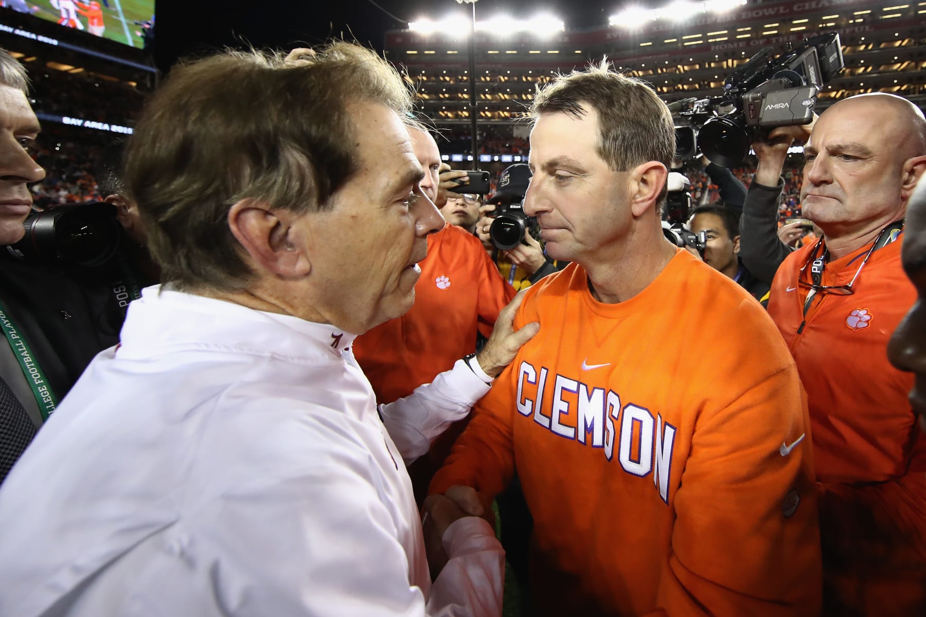 SANTA CLARA, CA - JANUARY 07:  Head coach Dabo Swinney of the Clemson Tigers meets head coach Nick Saban of the Alabama Crimson Tide at mid-field after his 44-16 win in the CFP National Championship presented by AT&T at Levi's Stadium on January 7, 2019 in Santa Clara, California.  (Photo by Ezra Shaw/Getty Images)