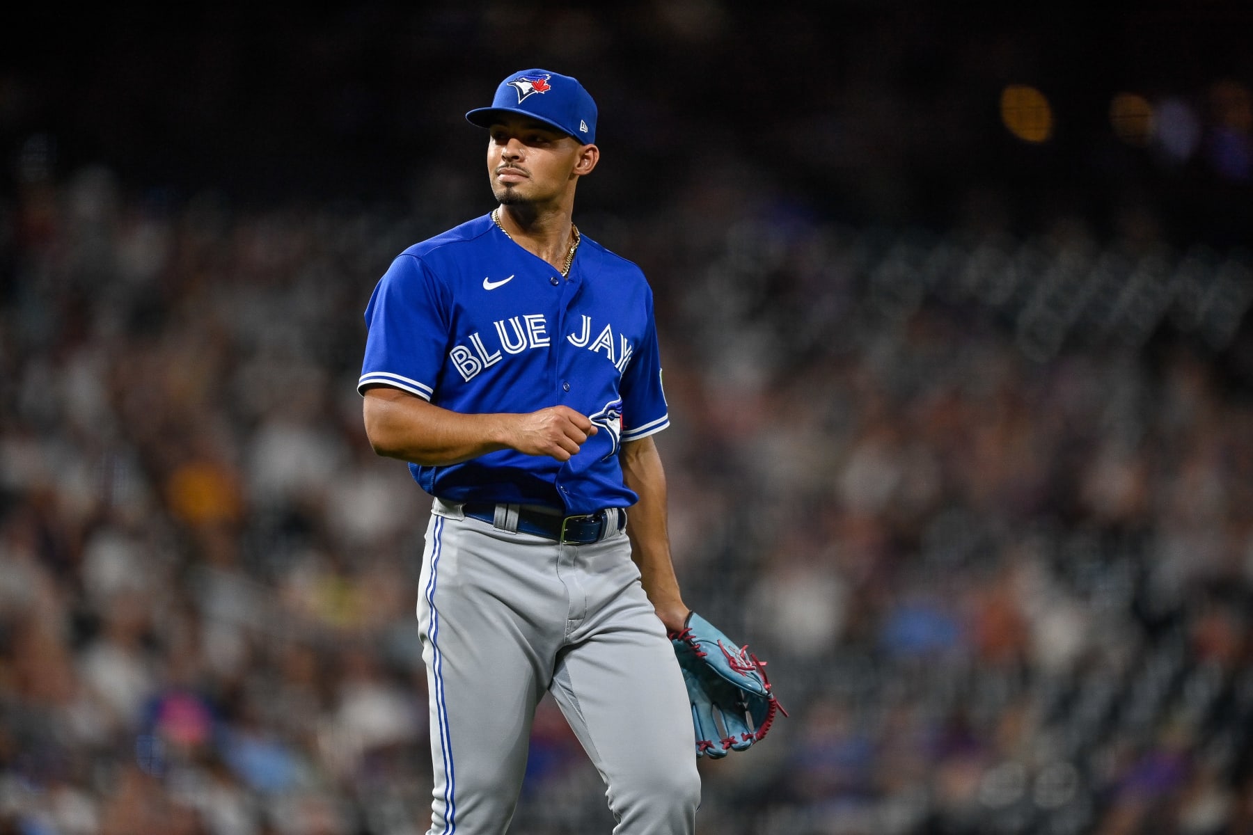 DENVER, CO - SEPTEMBER 1: Jordan Hicks #12 of the Toronto Blue Jays reacts as he pitches against the Colorado Rockies in the seventh inning at Coors Field on September 1, 2023 in Denver, Colorado. (Photo by Dustin Bradford/Getty Images)