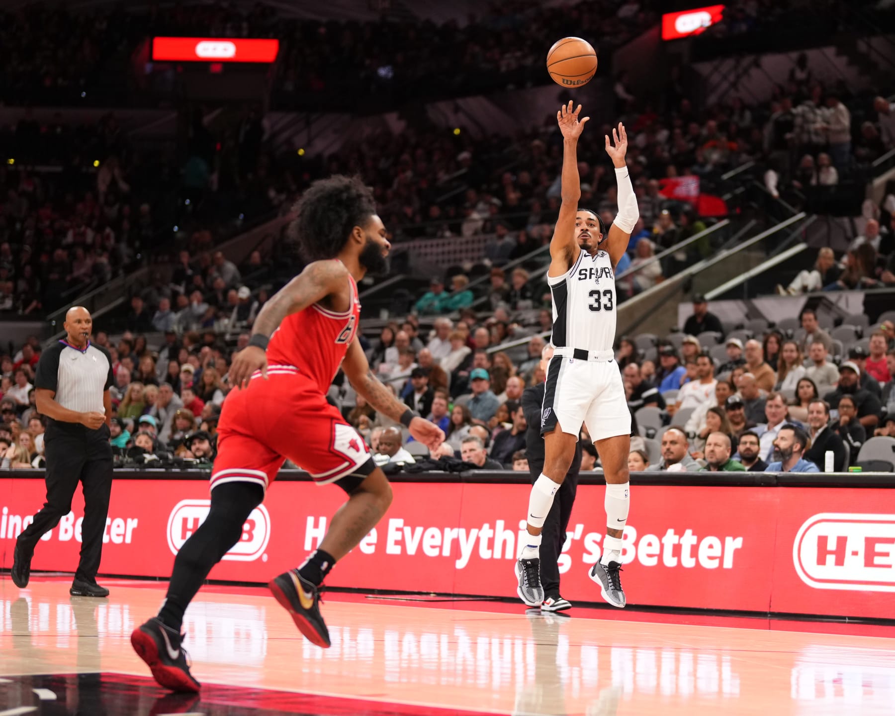 SAN ANTONIO, TX - JANUARY 13:  Tre Jones #33 of the San Antonio Spurs shoots a three point basket during the game against the Chicago Bulls on January 13, 2024 at the Frost Bank Center in San Antonio, Texas. NOTE TO USER: User expressly acknowledges and agrees that, by downloading and or using this photograph, user is consenting to the terms and conditions of the Getty Images License Agreement. Mandatory Copyright Notice: Copyright 2024 NBAE (Photos by Darren Carroll/NBAE via Getty Images)