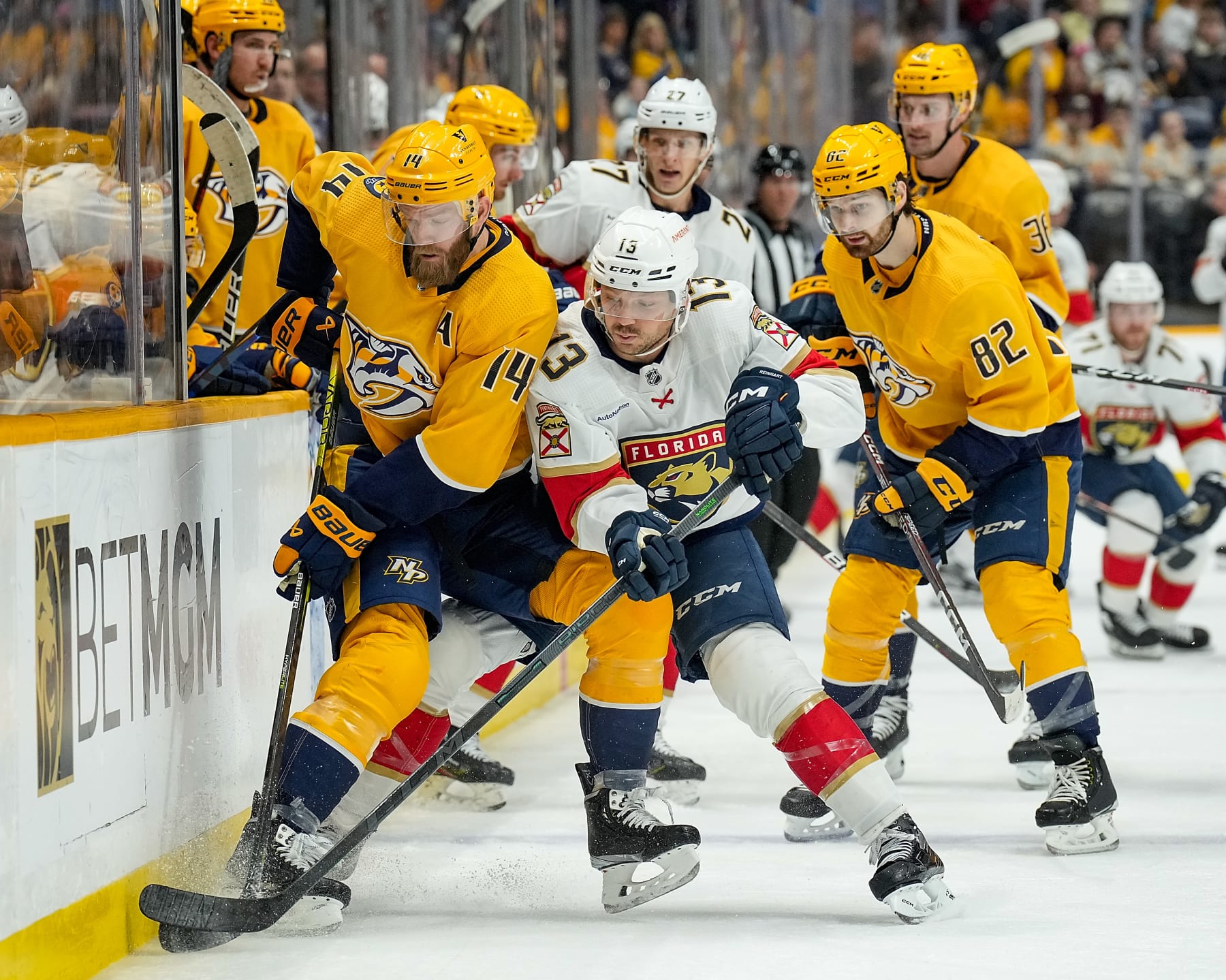 NASHVILLE, TENNESSEE - FEBRUARY 18: Sam Reinhart #13 of the Florida Panthers battles for the puck against Mattias Ekholm #14 of the Nashville Predators during an NHL game at Bridgestone Arena on February 18, 2023 in Nashville, Tennessee. (Photo by John Russell/NHLI via Getty Images)