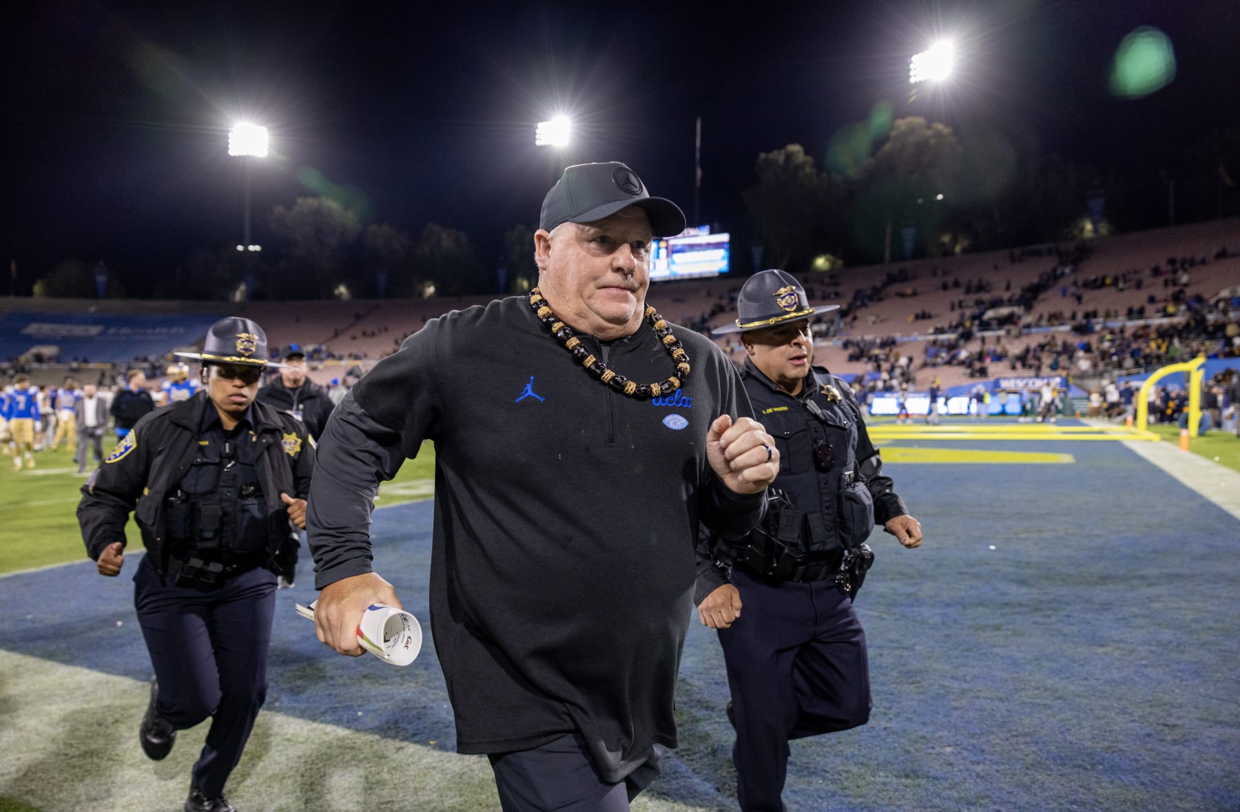PASADENA, CA - NOVEMBER 25, 2023: UCLA Bruins head coach Chip Kelly runs off the field after his team's 33-7 loss to California at the Rose Bowl on November 25, 2023 in Pasadena, California.(Gina Ferazzi / Los Angeles Times via Getty Images)