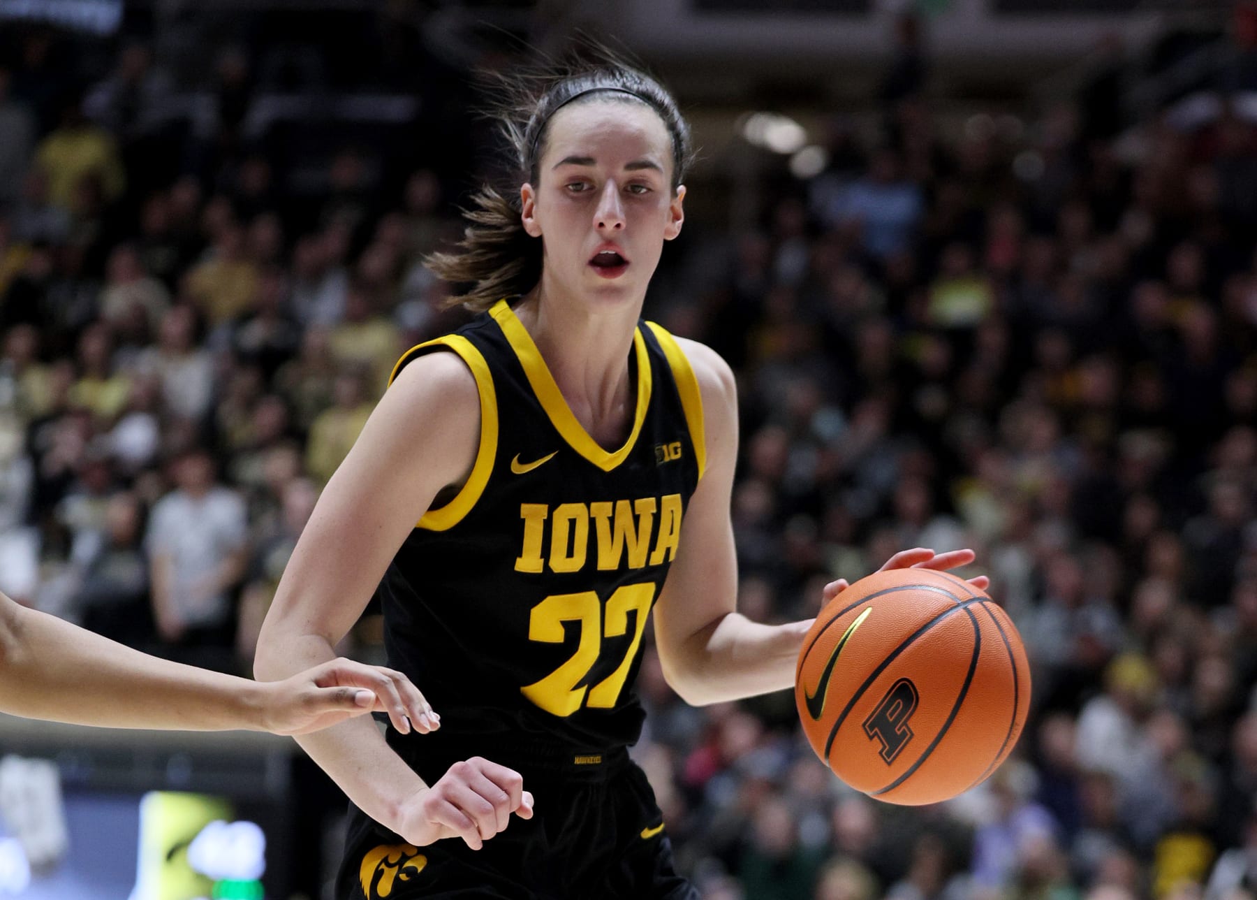 WEST LAFAYETTE, INDIANA - JANUARY 10: Caitlin Clark #22 of the Iowa Hawkeyes dribbles the ball in the first half against the Purdue Boilermakers at Mackey Arena on January 10, 2024 in West Lafayette, Indiana. (Photo by Andy Lyons/Getty Images)