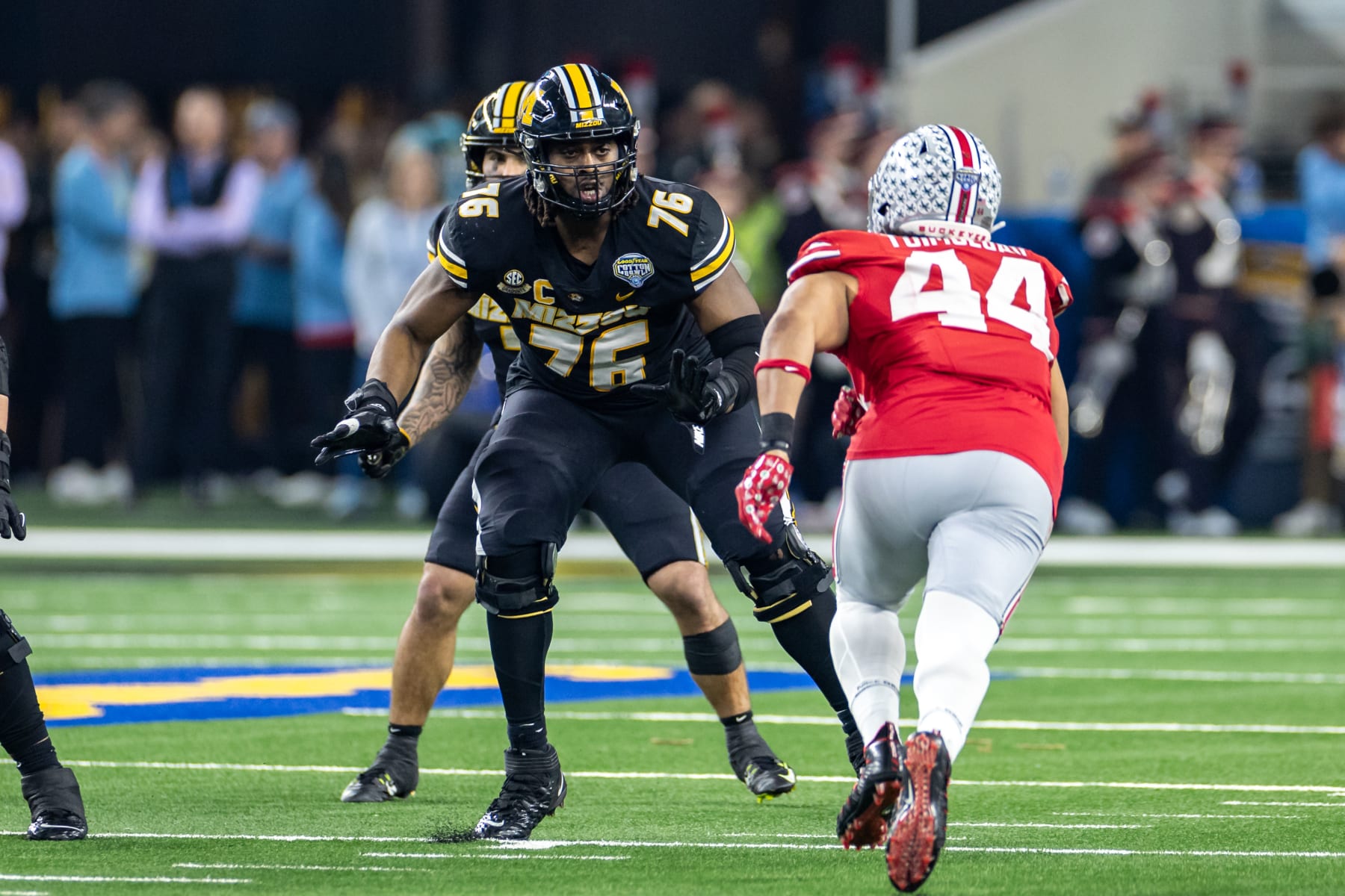 ARLINGTON, TX - DECEMBER 29: Missouri Tigers offensive lineman Javon Foster (#76) blocks during the Goodyear Cotton Bowl Classic football game between the Ohio State Buckeyes and Missouri Tigers on December 29, 2023 at AT&T Stadium in Arlington, TX.  (Photo by Matthew Visinsky/Icon Sportswire via Getty Images)