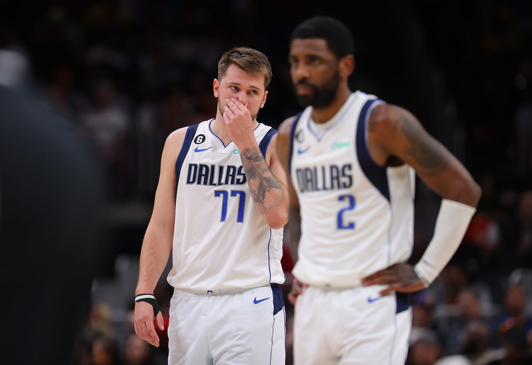 ATLANTA, GEORGIA - APRIL 02: Luka Doncic #77 and Kyrie Irving #2 of the Dallas Mavericks react against the Atlanta Hawks during the second quarter at State Farm Arena on April 02, 2023 in Atlanta, Georgia. NOTE TO USER: User expressly acknowledges and agrees that, by downloading and or using this photograph, User is consenting to the terms and conditions of the Getty Images License Agreement. (Photo by Kevin C. Cox/Getty Images)