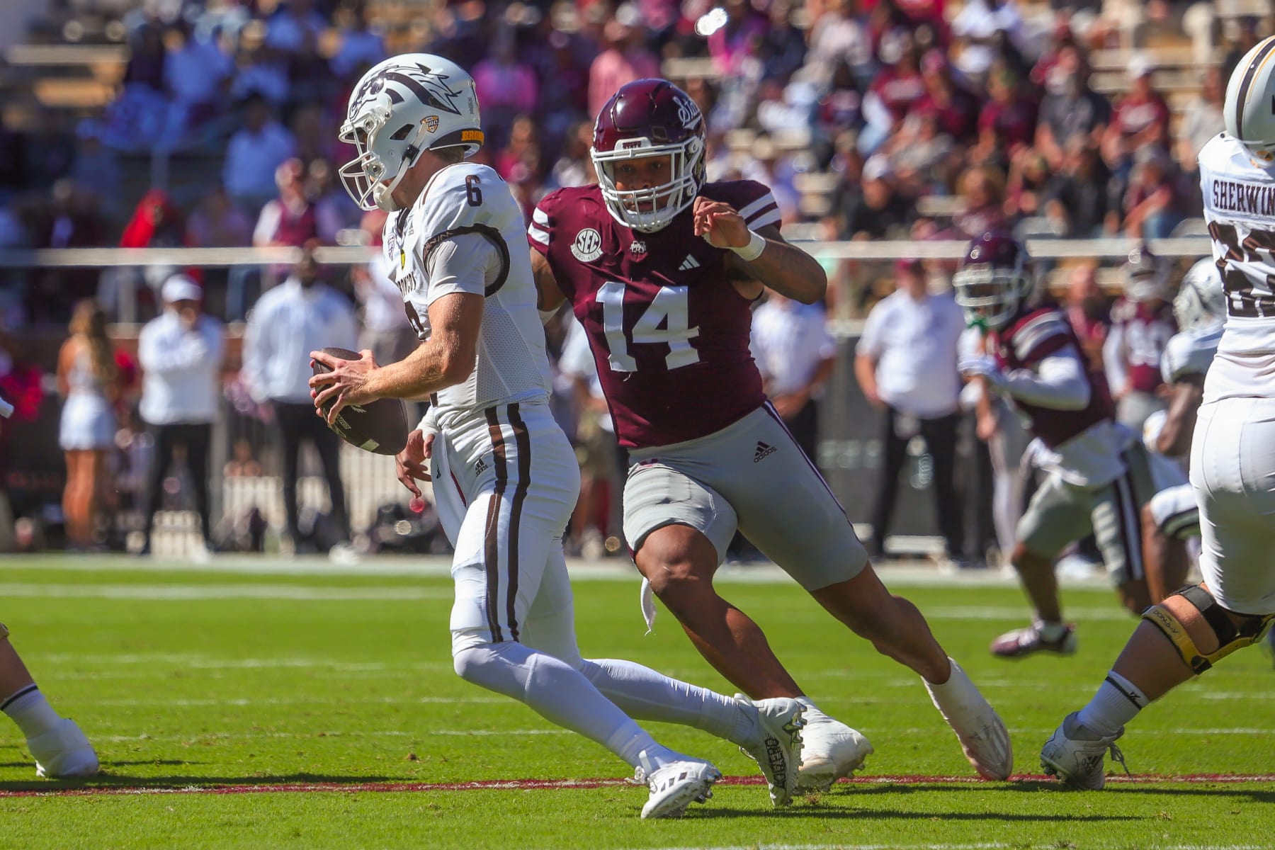 STARKVILLE, MS - OCTOBER 07: Mississippi State Bulldogs linebacker Nathaniel Watson (14) chases Western Michigan Broncos quarterback Jack Salopek (6) during the game between the Western Michigan Broncos and the Mississippi State Bulldogs on October 7, 2023 at Davis Wade Stadium at Scott Field in Starkville, MS. (Photo by Chris McDill/Icon Sportswire via Getty Images)