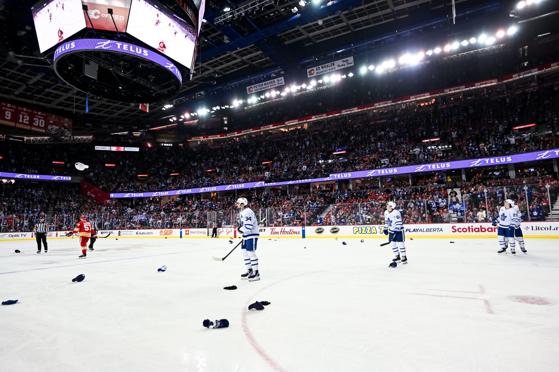 CALGARY, AB - JANUARY 18: Hats are thrown onto the ice after Toronto Maple Leafs Center Auston Matthews (34) scored his third goal of the game during the second period of an NHL game between the Calgary Flames and the Toronto Maple Leafs on January 18, 2024, at the Scotiabank Saddledome in Calgary, AB. (Photo by Brett Holmes/Icon Sportswire via Getty Images)