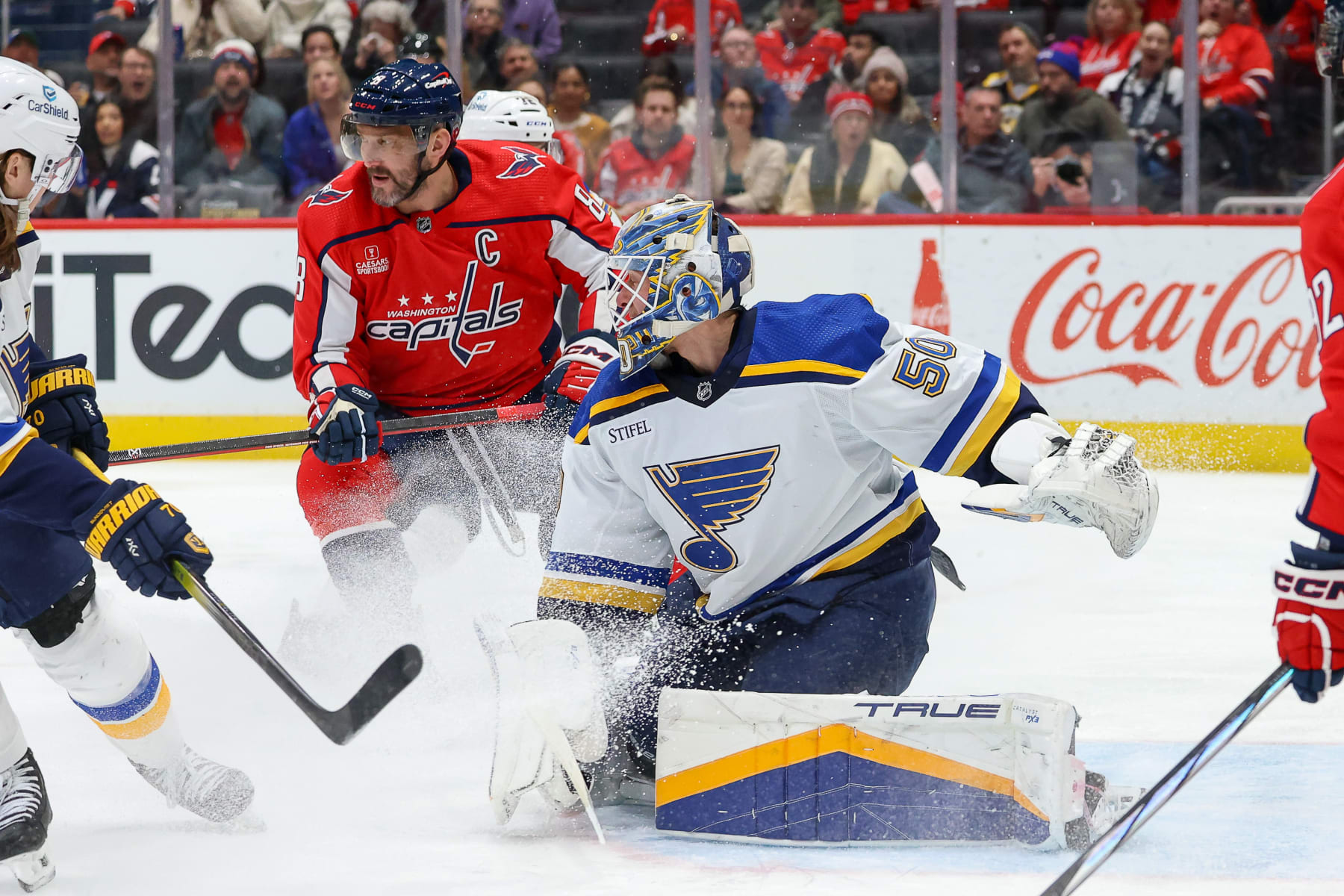 WASHINGTON, DC - JANUARY 18: Jordan Binnington #50 of the St. Louis Blues makes a save as Alex Ovechkin #8 of the Washington Capitals looks for a rebound during a game at Capital One Arena on January 18, 2024 in Washington, D.C. (Photo by John McCreary/NHLI via Getty Images)