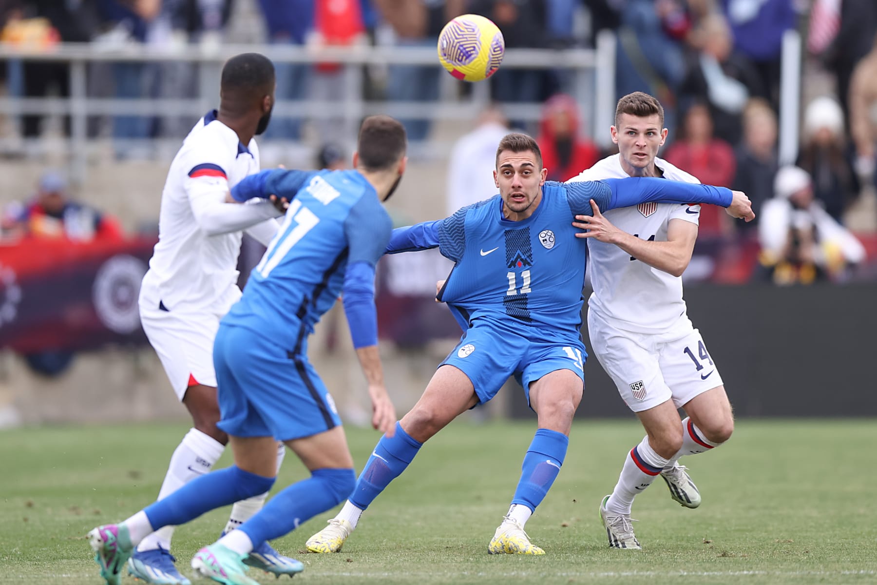 SAN ANTONIO, TEXAS - JANUARY 20: Nejc Gradisar #11 of Slovenia and Sean Zawadzki #14 of United States battle for the ball during a match between Slovenia and United States at Toyota Field on January 20, 2024 in San Antonio, Texas. (Photo by Omar Vega/Getty Images)